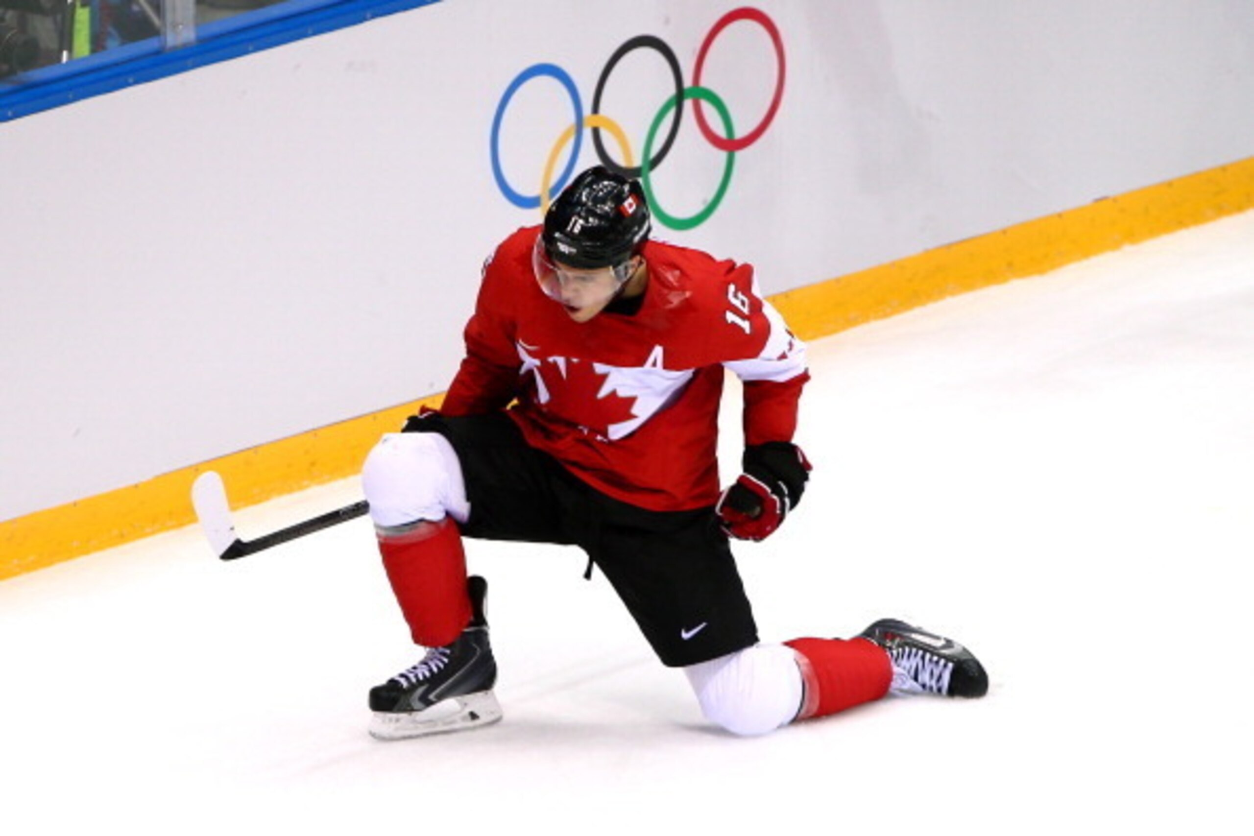 SOCHI, RUSSIA - FEBRUARY 23:  Jonathan Toews #16 of Canada celebrates after scoring the opening goal against Henrik Lundqvist #30 of Sweden in the first period during the Men's Ice Hockey Gold Medal match on Day 16 of the 2014 Sochi Winter Olympics at Bol