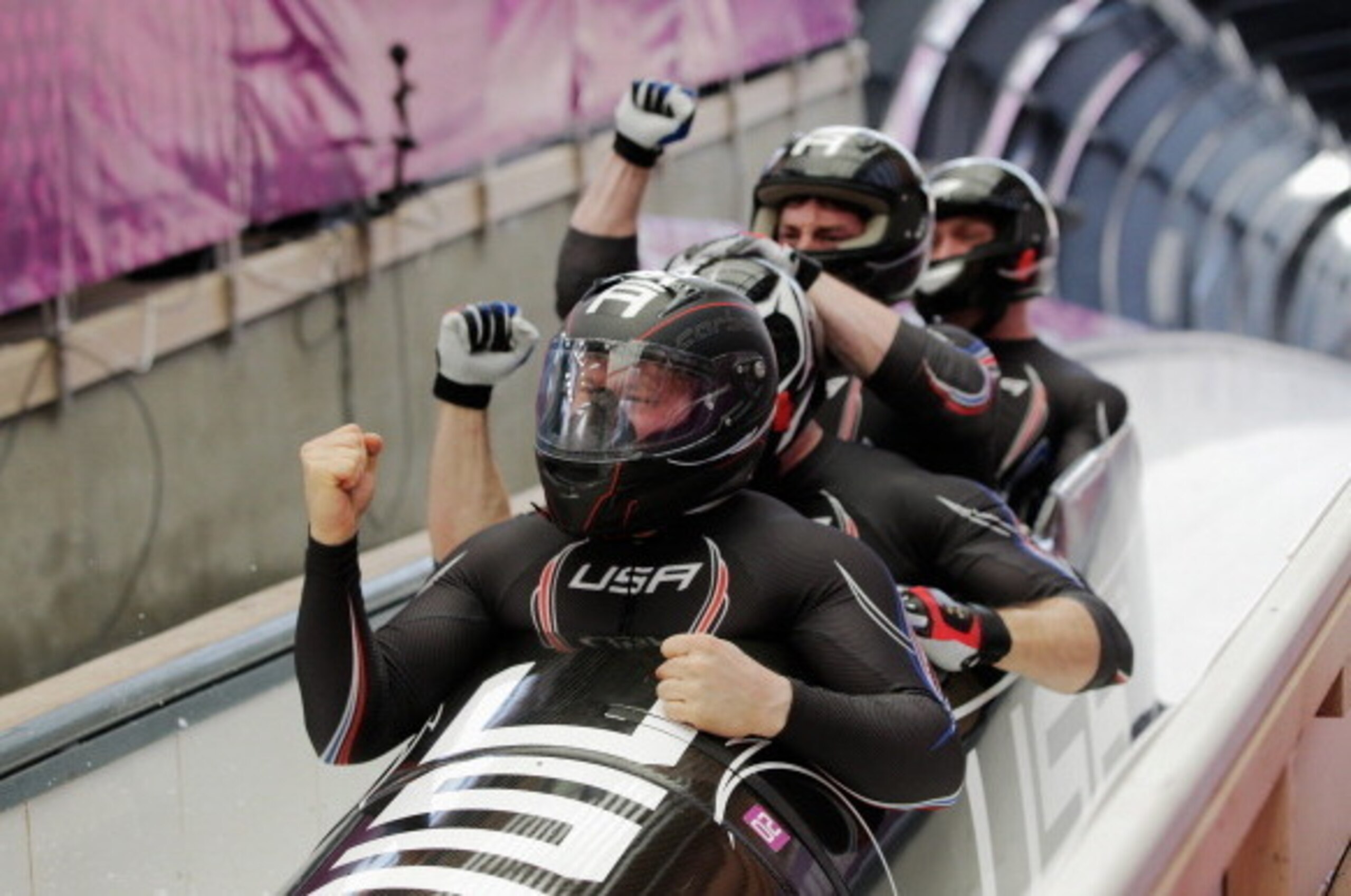 SOCHI, RUSSIA - FEBRUARY 23: Pilot Steven Holcomb, Curtis Tomasevicz, Steven Langton and Christopher Fogt of the United States team 1 finish the final run during the Men's Four Man Bobsleigh on day 16 of the Sochi 2014 Winter Olympics at Sliding Center S SOCHI, RUSSIA - FEBRUARY 23: Pilot Steven Holcomb, Curtis Tomasevicz, Steven Langton and Christopher Fogt of the United States team 1 finish the final run during the Men's Four Man Bobsleigh on day 16 of the Sochi 2014 Winter Olympics at Sliding Center S