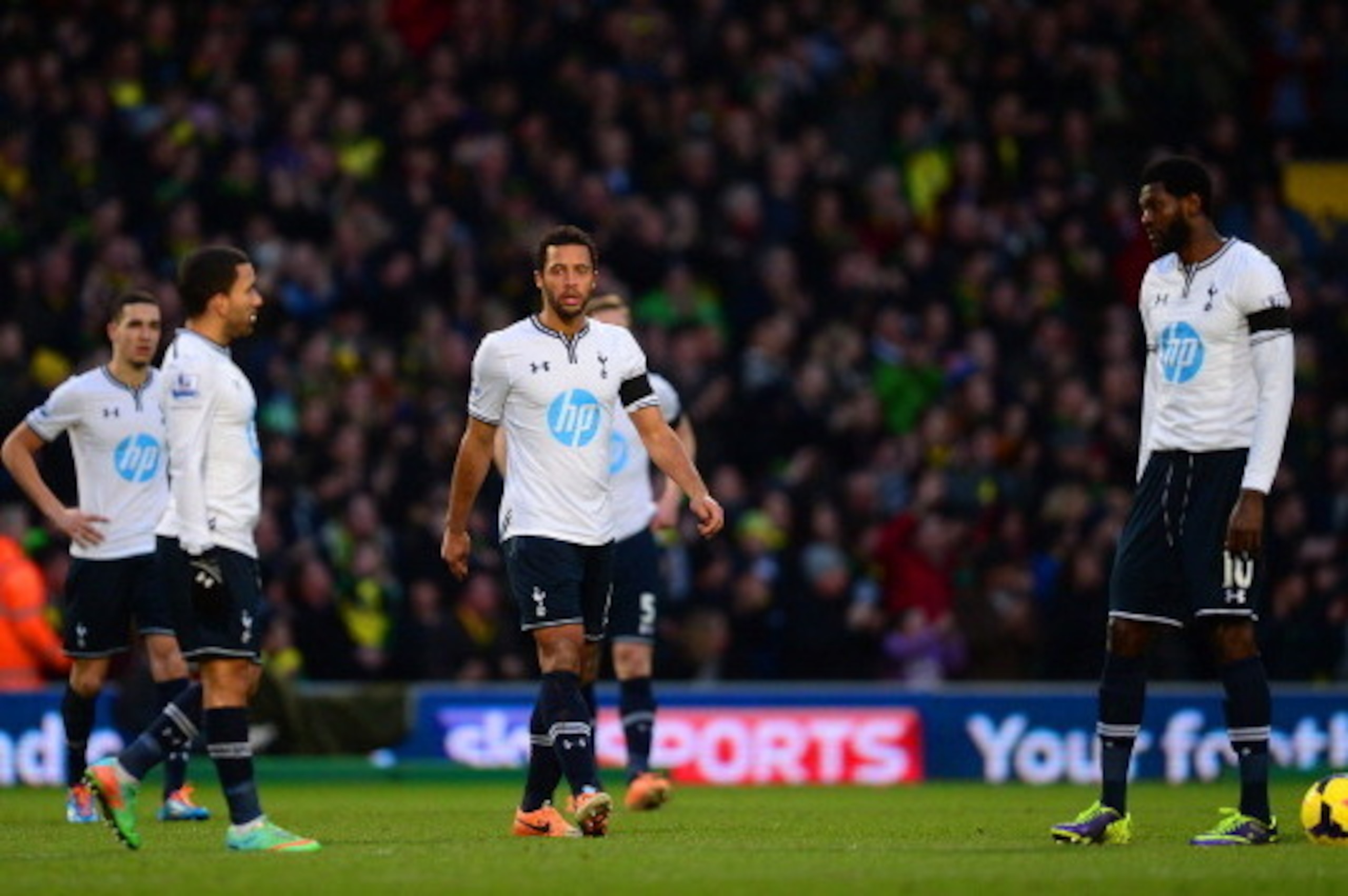 NORWICH, ENGLAND - FEBRUARY 23: A dejected Aaron Lennon, Mousa Dembele and Emmanuel Adebayor of Tottenham Hotspur look on during the Barclays Premier League match between Norwich City and Tottenham Hotspur at Carrow Road on February 23, 2014 in Norwich, E NORWICH, ENGLAND - FEBRUARY 23: A dejected Aaron Lennon, Mousa Dembele and Emmanuel Adebayor of Tottenham Hotspur look on during the Barclays Premier League match between Norwich City and Tottenham Hotspur at Carrow Road on February 23, 2014 in Norwich, E