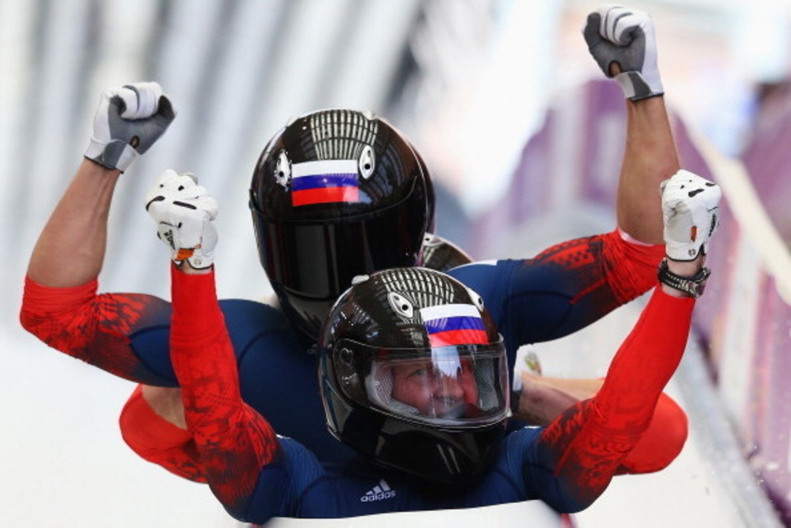 SOCHI, RUSSIA - FEBRUARY 23:  Pilot Alexander Zubkov, Alexey Negodaylo, Dmitry Trunenkov and Alexey Voevoda of Russia team 1 celebrate winning the gold medal during the Men's Four-Man Bobsleigh on Day 16 of the Sochi 2014 Winter Olympics at Sliding Center