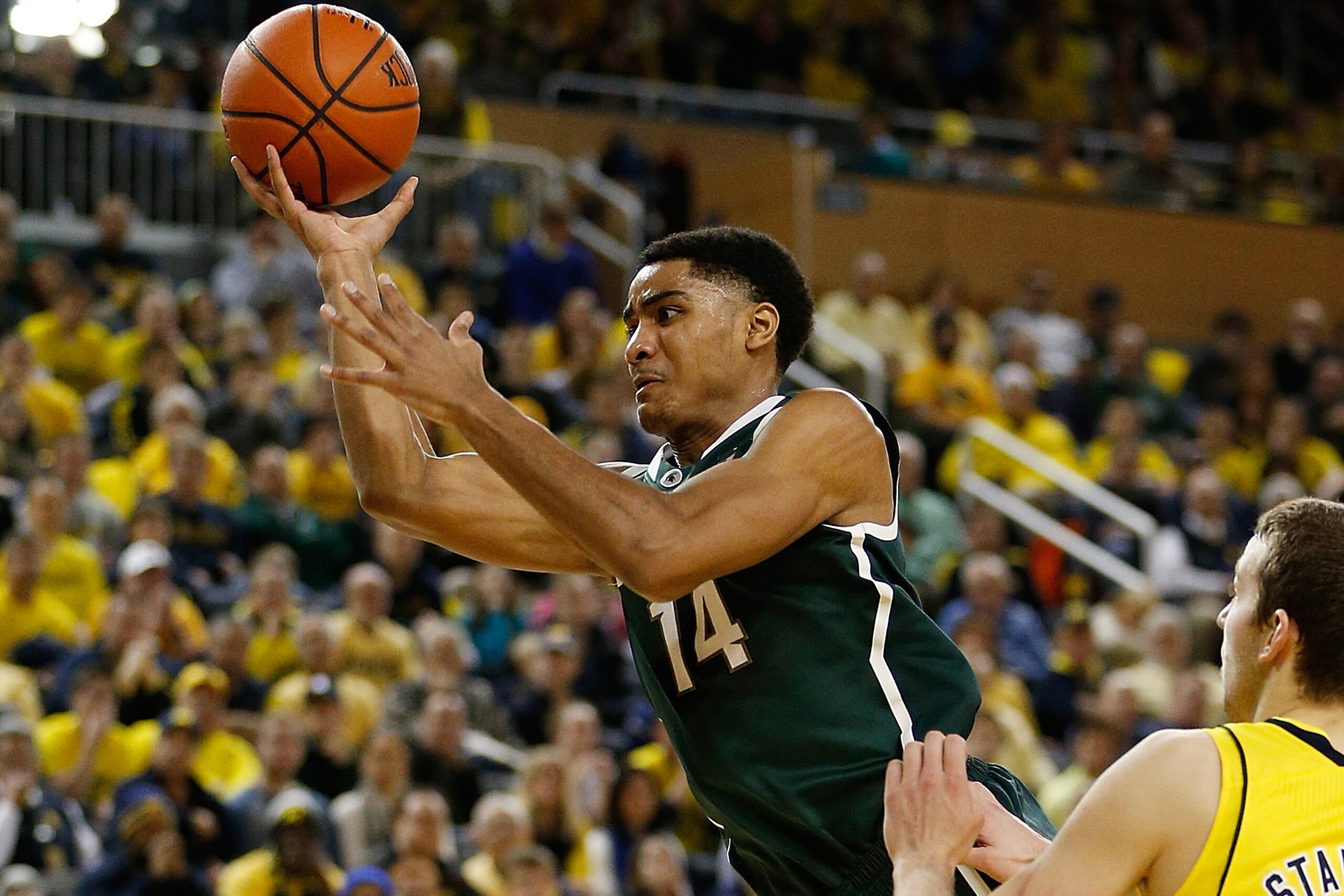 ANN ARBOR, MI - FEBRUARY 23: Gary Harris #14 of the Michigan State Spartans tries to get a first half shot off after being fouled by Spike Albrecht #2 of the Michigan Wolverines at Crisler Center on February 23, 2014 in Ann Arbor, Michigan. (Photo by Greg ANN ARBOR, MI - FEBRUARY 23: Gary Harris #14 of the Michigan State Spartans tries to get a first half shot off after being fouled by Spike Albrecht #2 of the Michigan Wolverines at Crisler Center on February 23, 2014 in Ann Arbor, Michigan. (Photo by Greg
