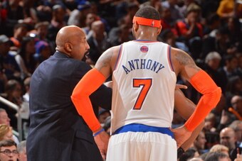 NEW YORK, NY - FEBRUARY 12:  Mike Woodson and Carmelo Anthony #7 of the New York Knicks talk during the game against the Sacramento Kings on February 12, 2014 at Madison Square Garden in New York City, New York. NOTE TO USER: User expressly acknowledges a