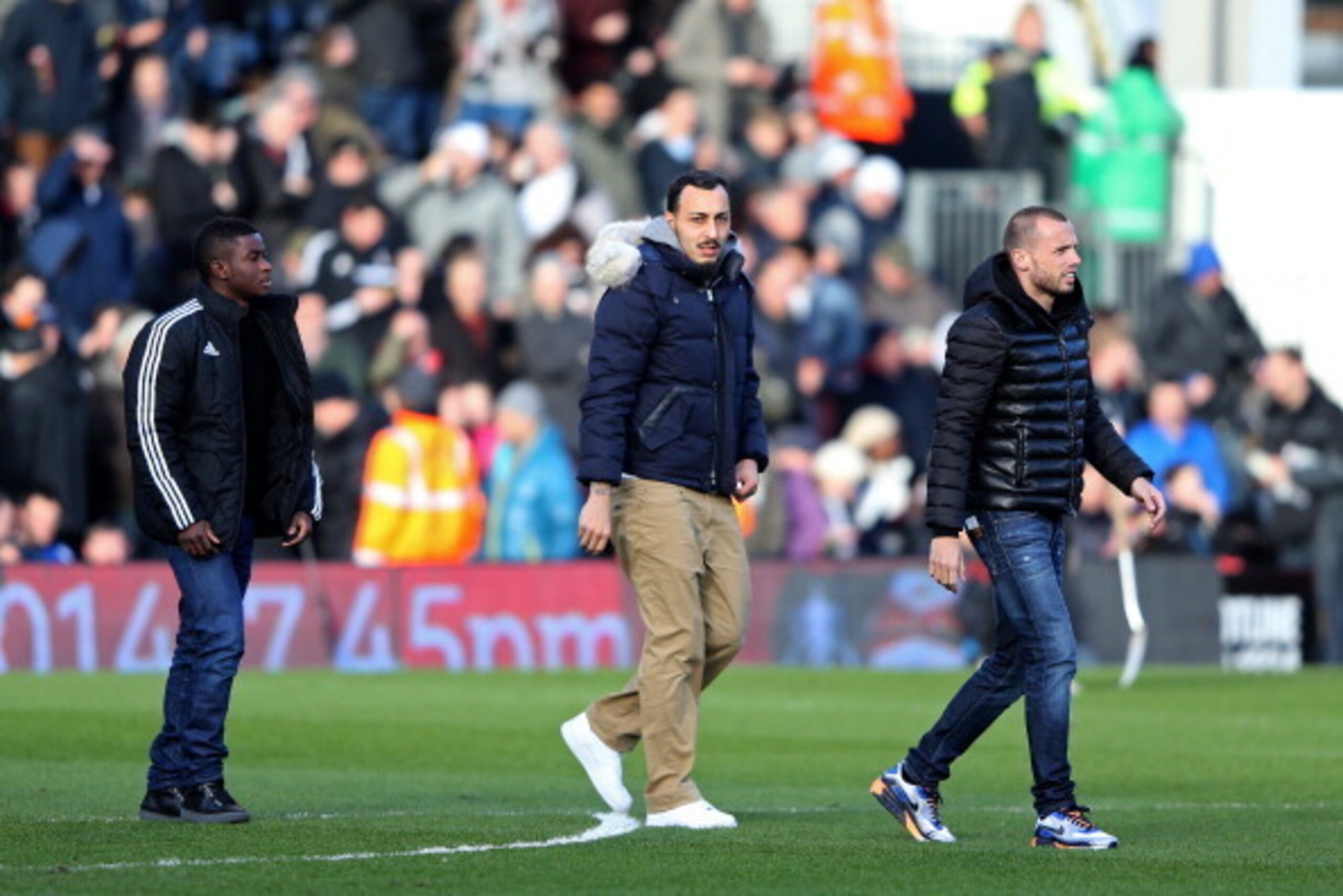 LONDON, ENGLAND - FEBRUARY 01:  New signings (L-R) Larnell Cole, Kostas Mitroglou and John Heitinga of Fulham walk onto the pitch before the Barclays Premier League match between Fulham and Southampton at Craven Cottage on February 1, 2014 in London, Engl