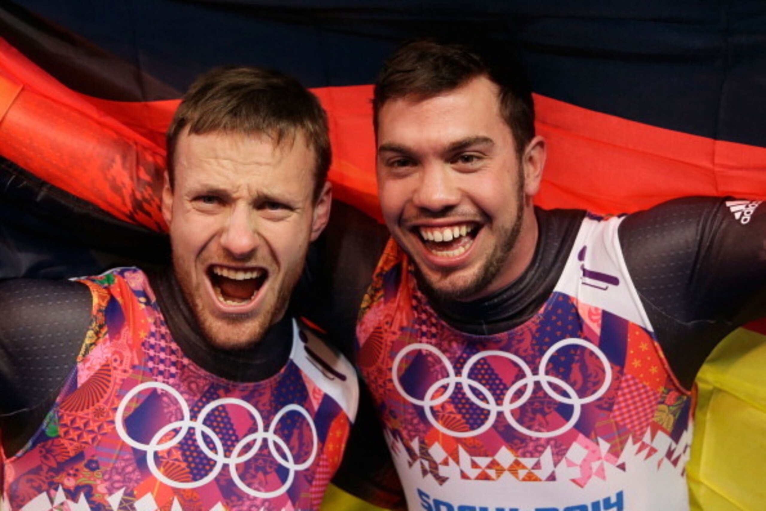 SOCHI, RUSSIA - FEBRUARY 12:  Tobias Wendl (R) and Tobias Arlt of Germany celebrate after winning the gold medal during the Men's Luge Doubles on Day 5 of the Sochi 2014 Winter Olympics at Sliding Center Sanki on February 12, 2014 in Sochi, Russia.  (Phot