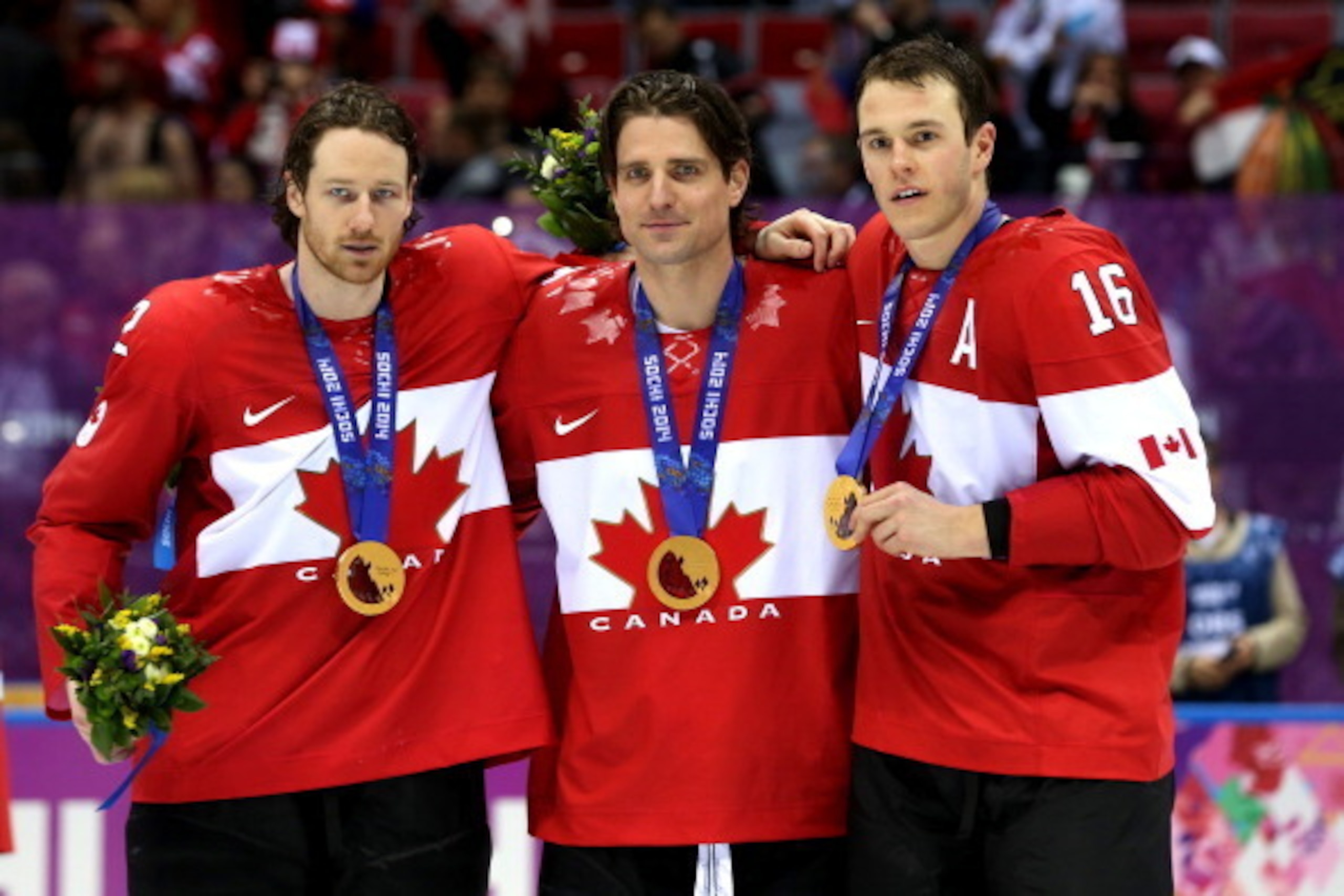SOCHI, RUSSIA - FEBRUARY 23:  (L-R) Duncan Keith #2, Patrick Sharp #10 and Jonathan Toews #16 of Canada pose with the gold medlas won during the Men's Ice Hockey Gold Medal match on Day 16 of the 2014 Sochi Winter Olympics at Bolshoy Ice Dome on February 