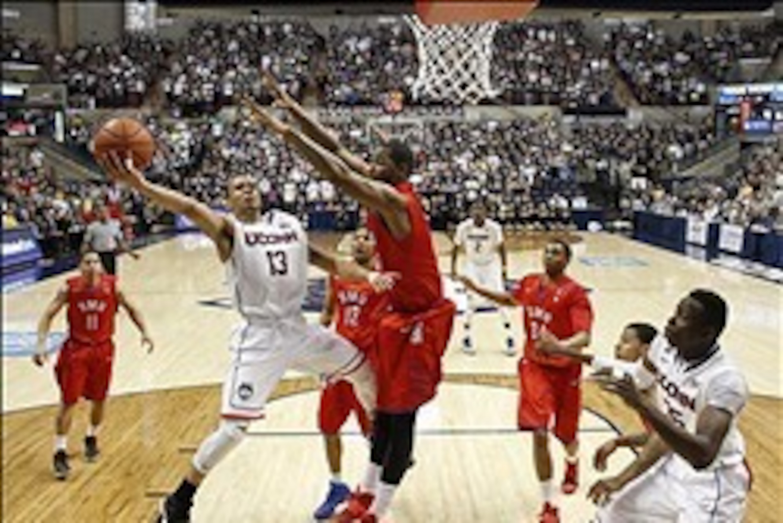 Feb 23, 2014; Storrs, CT, USA; Connecticut Huskies guard Shabazz Napier (13) shoots against Southern Methodist Mustangs forward Markus Kennedy (5) in the second half at Harry A. Gampel Pavilion. SMU defeated UConn 64-55. Mandatory Credit: David Butler II- Feb 23, 2014; Storrs, CT, USA; Connecticut Huskies guard Shabazz Napier (13) shoots against Southern Methodist Mustangs forward Markus Kennedy (5) in the second half at Harry A. Gampel Pavilion. SMU defeated UConn 64-55. Mandatory Credit: David Butler II-
