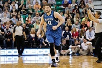 Feb 22, 2014; Salt Lake City, UT, USA; Minnesota Timberwolves power forward Kevin Love (42) runs up the court after scoring a three point shoot.  Love would end the game with a triple double (37 points, 12 rebounds, 10 assists) against the Utah Jazz at En