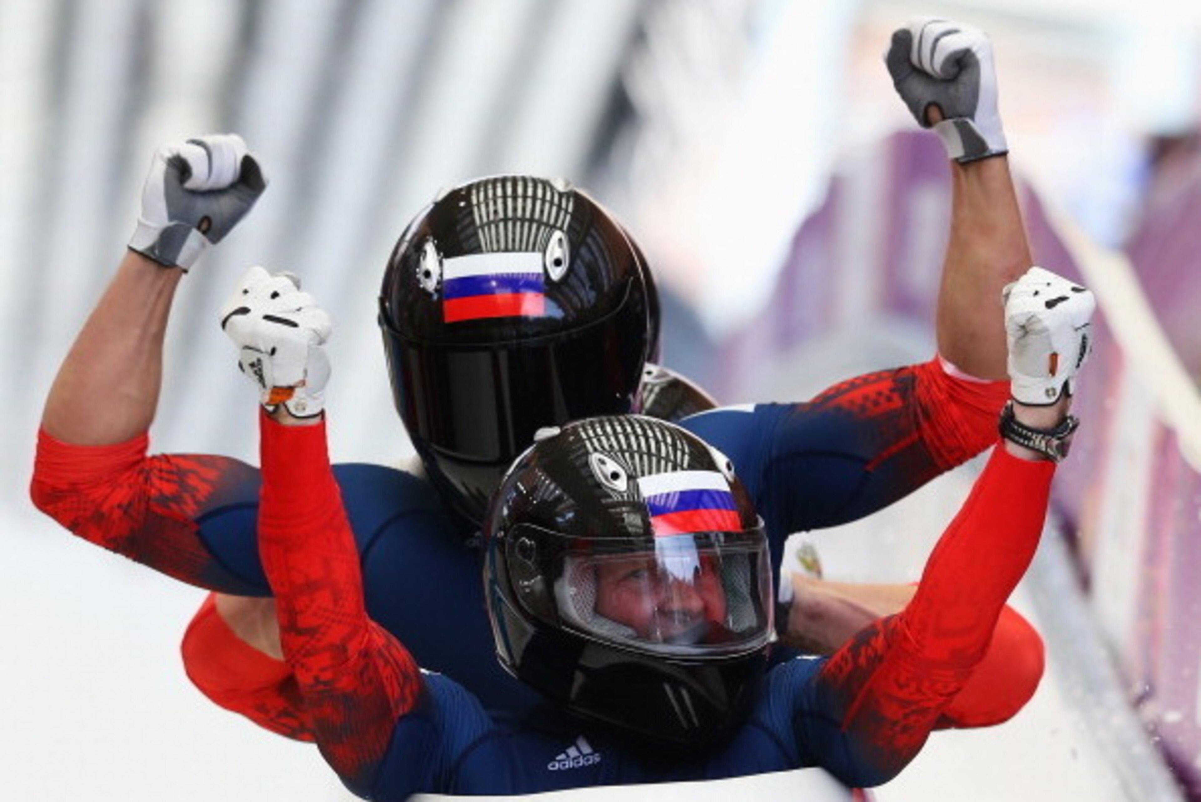 SOCHI, RUSSIA - FEBRUARY 23:  Pilot Alexander Zubkov, Alexey Negodaylo, Dmitry Trunenkov and Alexey Voevoda of Russia team 1 celebrate winning the gold medal during the Men's Four-Man Bobsleigh on Day 16 of the Sochi 2014 Winter Olympics at Sliding Center