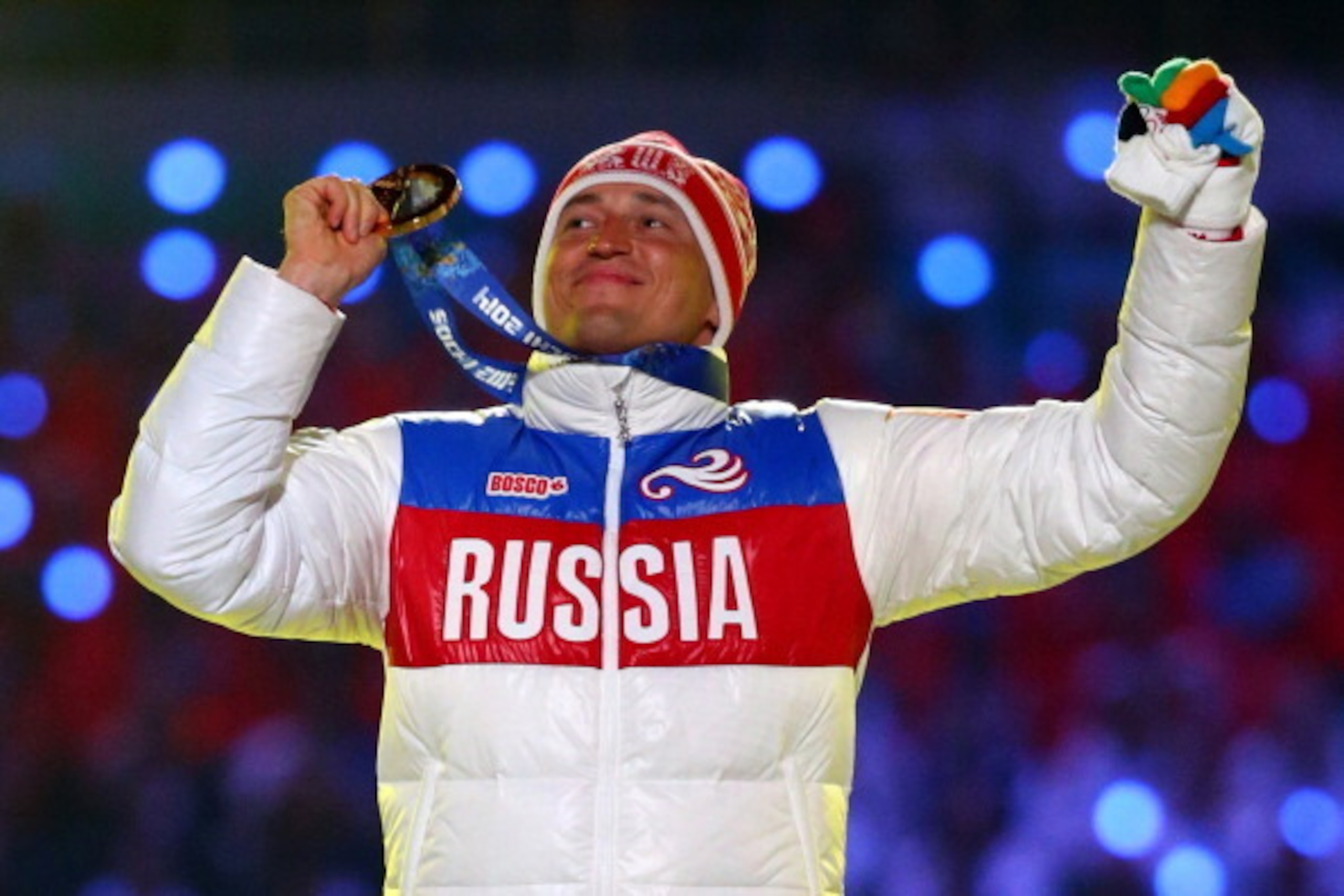 SOCHI, RUSSIA - FEBRUARY 23:  Gold medalist Alexander Legkov of Russia celebrates in the medal ceremony for the Men's 50 km Mass Start Free during the 2014 Sochi Winter Olympics Closing Ceremony at Fisht Olympic Stadium on February 23, 2014 in Sochi, Russ