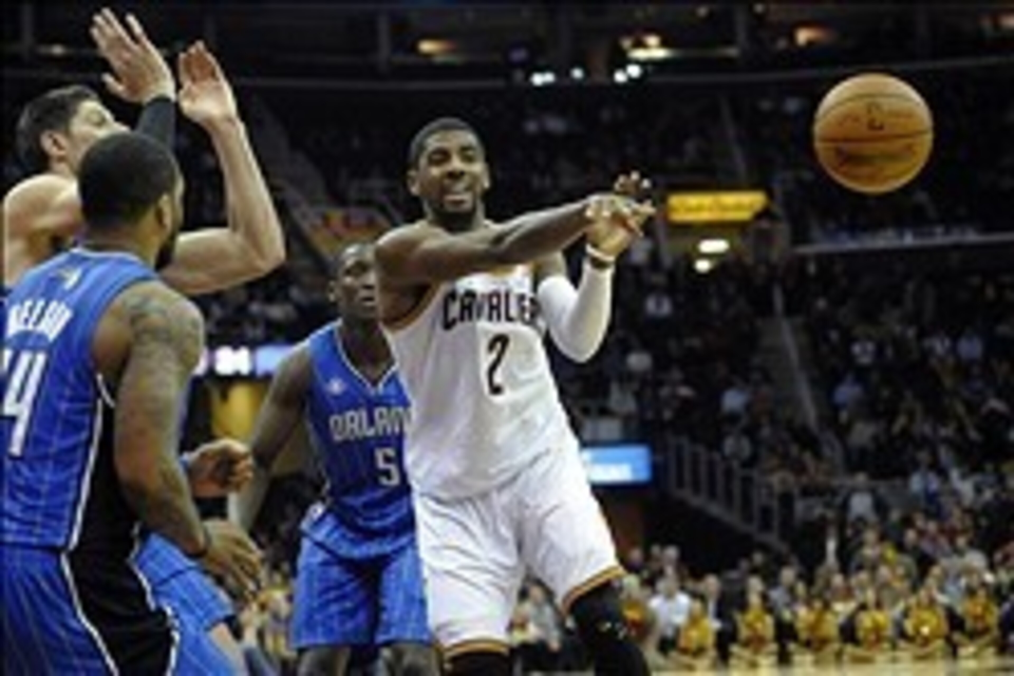 Feb 19, 2014; Cleveland, OH, USA; Cleveland Cavaliers point guard Kyrie Irving (2) passes in the fourth quarter against the Orlando Magic at Quicken Loans Arena. Mandatory Credit: David Richard-USA TODAY Sports