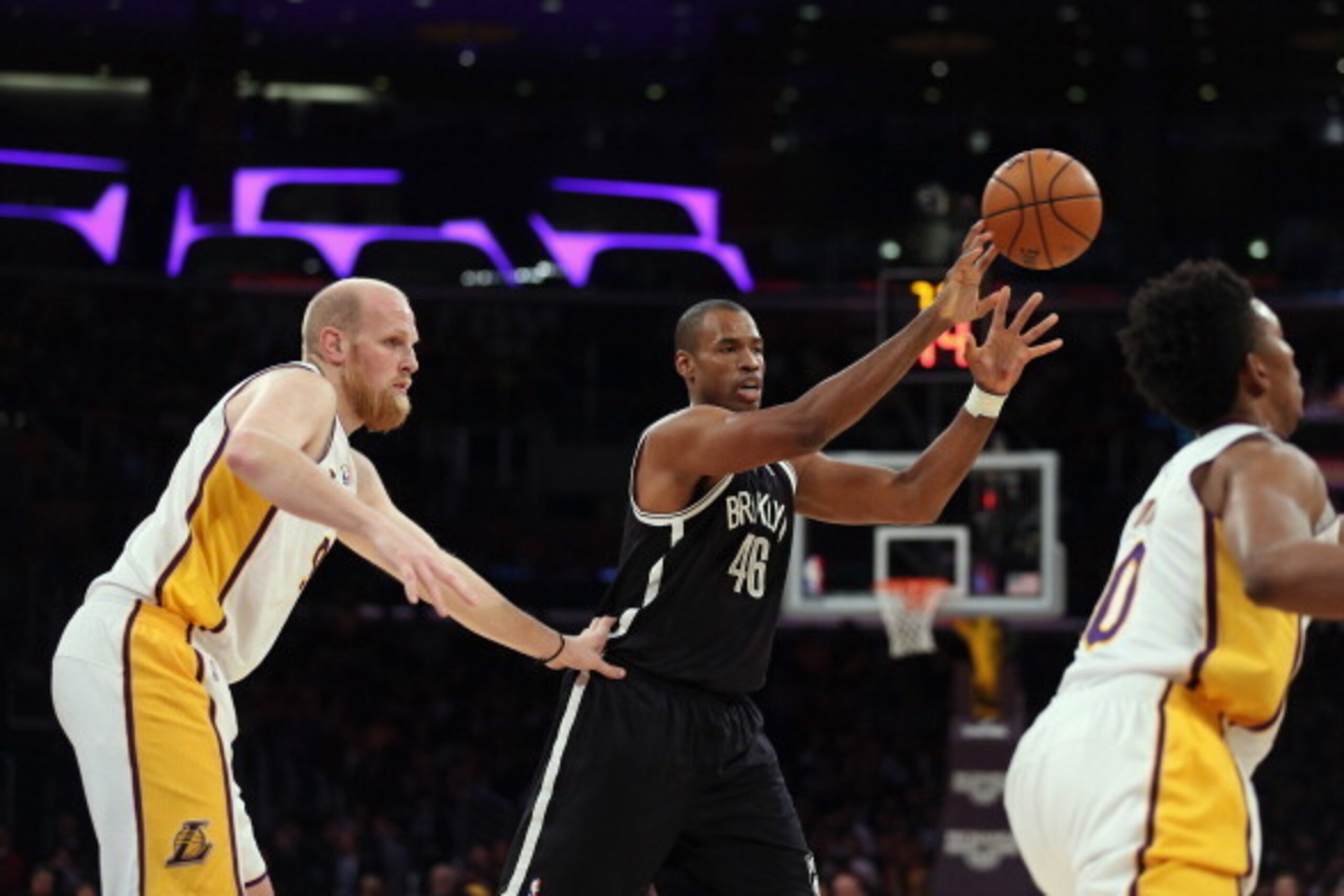 LOS ANGELES, CA - FEBRUARY 23:  Jason Collins #98 of the Brooklyn Nets is defended by Chris Kaman #9 of the Los Angeles Lakers in the first half at Staples Center on February 23, 2014 in Los Angeles, California. NOTE TO USER: User expressly acknowledges a