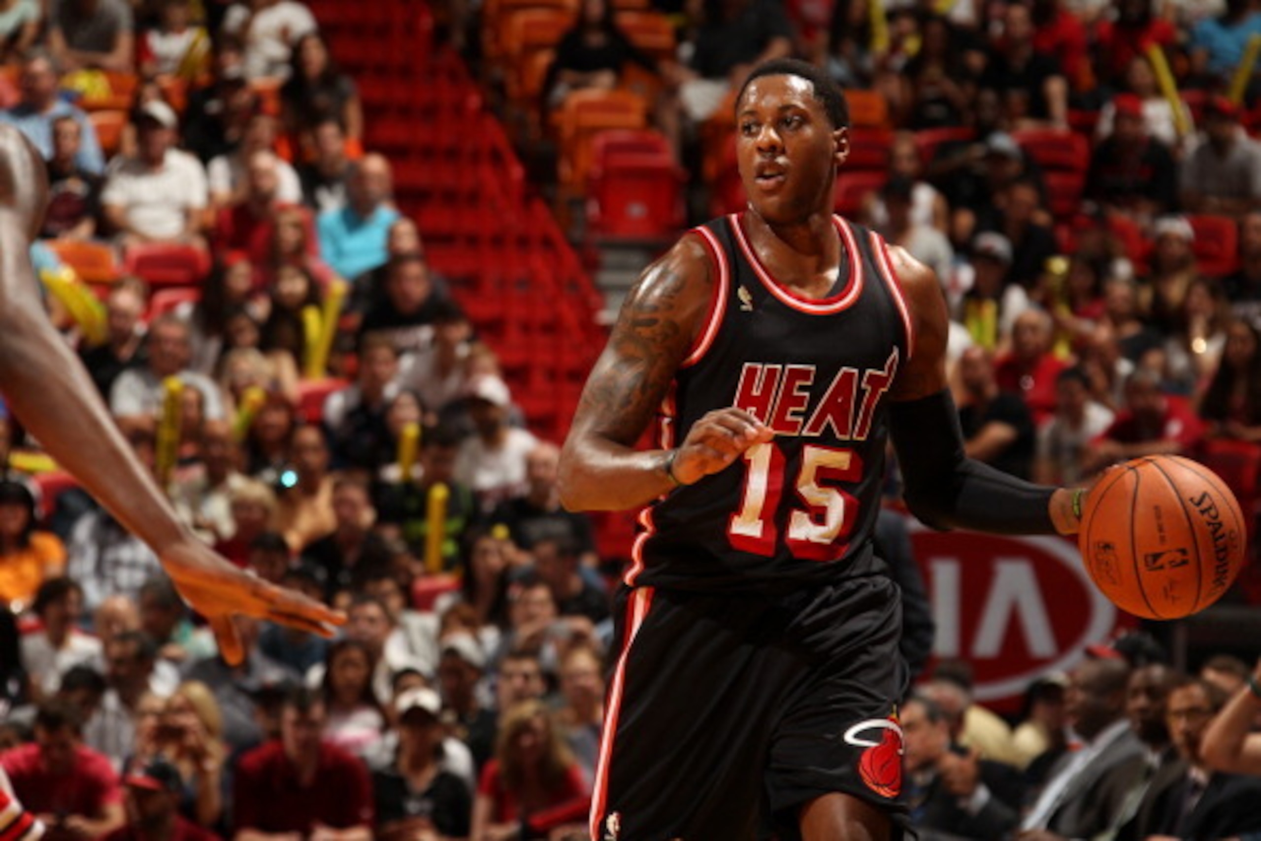 MIAMI, FL - February 23: Mario Chalmers #15 of the Miami Heat looks to pass the ball against the Chicago Bulls at the American Airlines Arena in Miami, Florida on Feb. 3, 2014. NOTE TO USER: User expressly acknowledges and agrees that, by downloading and/ MIAMI, FL - February 23: Mario Chalmers #15 of the Miami Heat looks to pass the ball against the Chicago Bulls at the American Airlines Arena in Miami, Florida on Feb. 3, 2014. NOTE TO USER: User expressly acknowledges and agrees that, by downloading and/