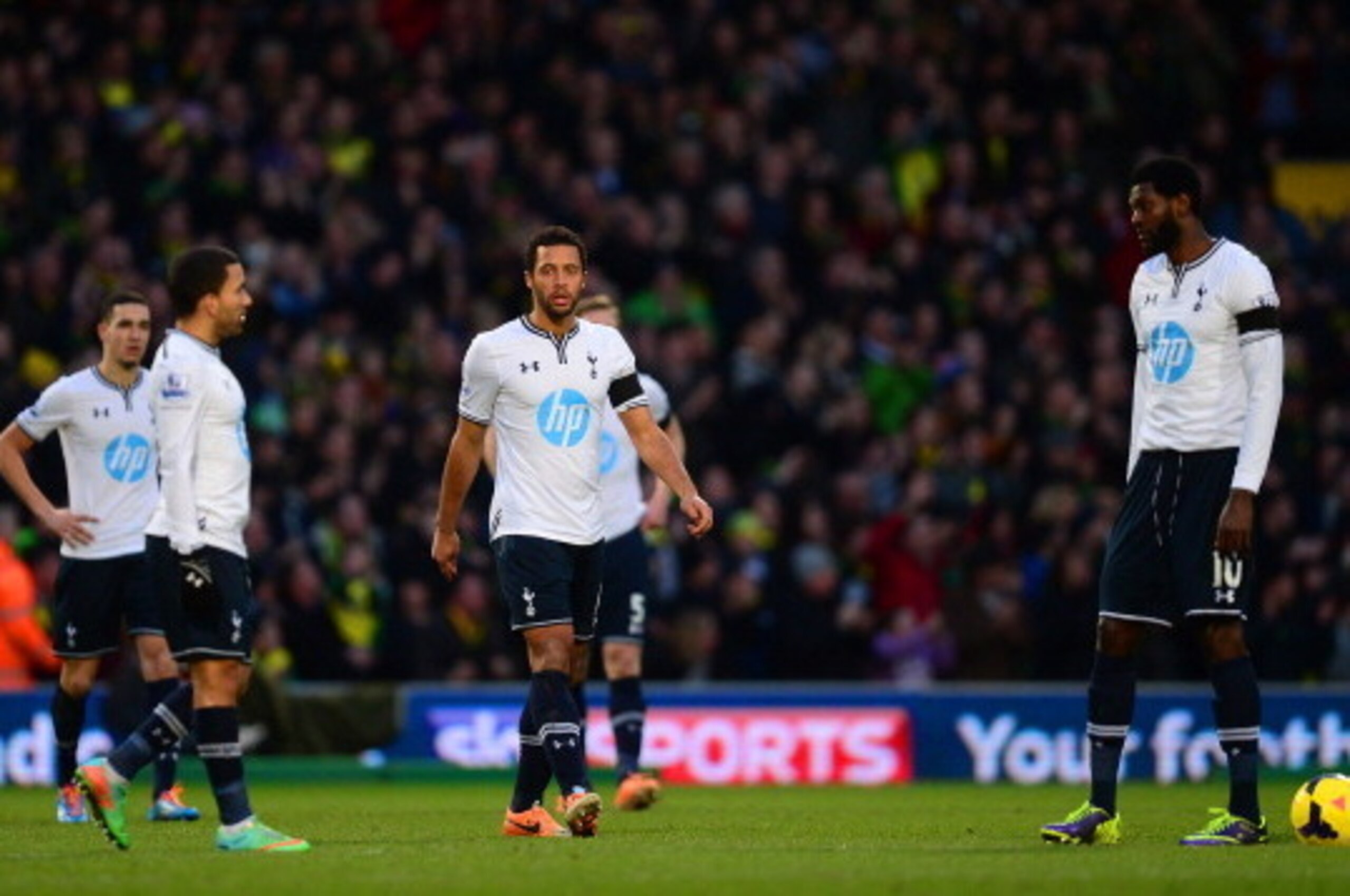 NORWICH, ENGLAND - FEBRUARY 23: A dejected Aaron Lennon, Mousa Dembele and Emmanuel Adebayor of Tottenham Hotspur look on during the Barclays Premier League match between Norwich City and Tottenham Hotspur at Carrow Road on February 23, 2014 in Norwich, E