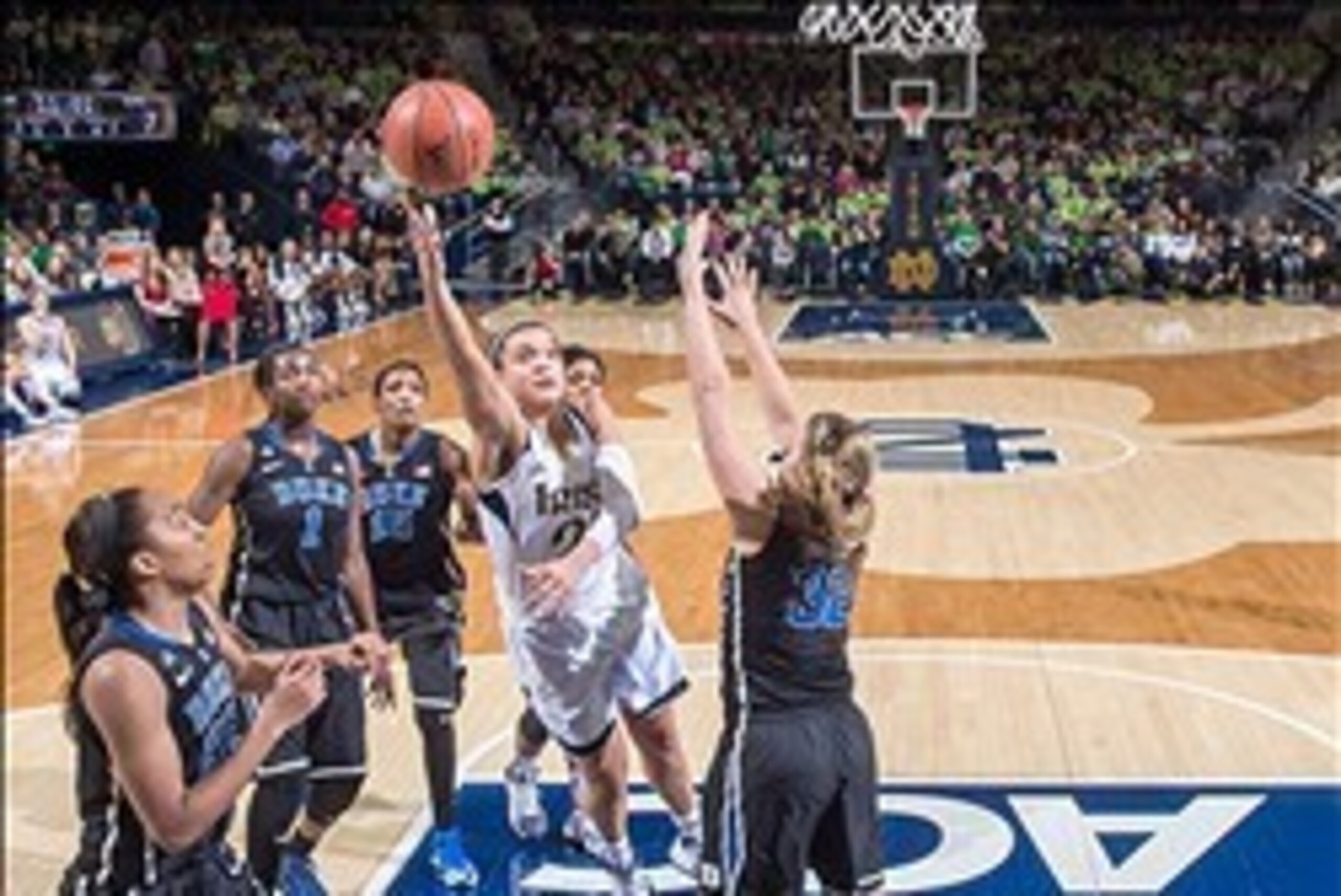 Feb 23, 2014; South Bend, IN, USA; Notre Dame Fighting Irish guard Kayla McBride (21) goes up for a shot as Duke Blue Devils guard Tricia Liston (32) defends in the first half at the Purcell Pavilion. Notre Dame won 81-70. Mandatory Credit: Matt Cashore-U