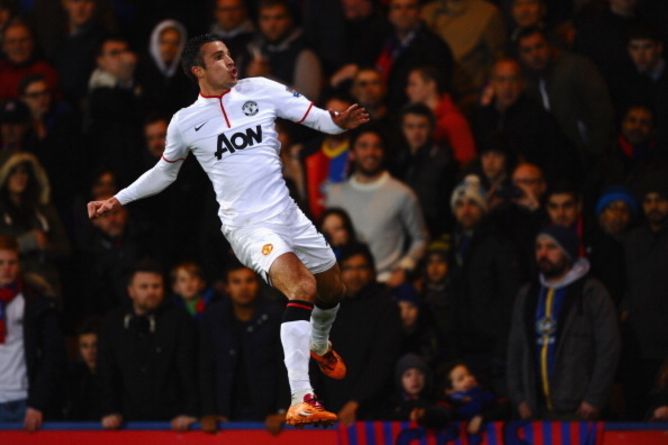 LONDON, ENGLAND - FEBRUARY 22:  Robin Van Persie of Manchester United jumps for joy as he celebrates the first goal during the Barclays Premier League match between Crystal Palace and Manchester United at Selhurst Park on February 22, 2014 in London, Engl