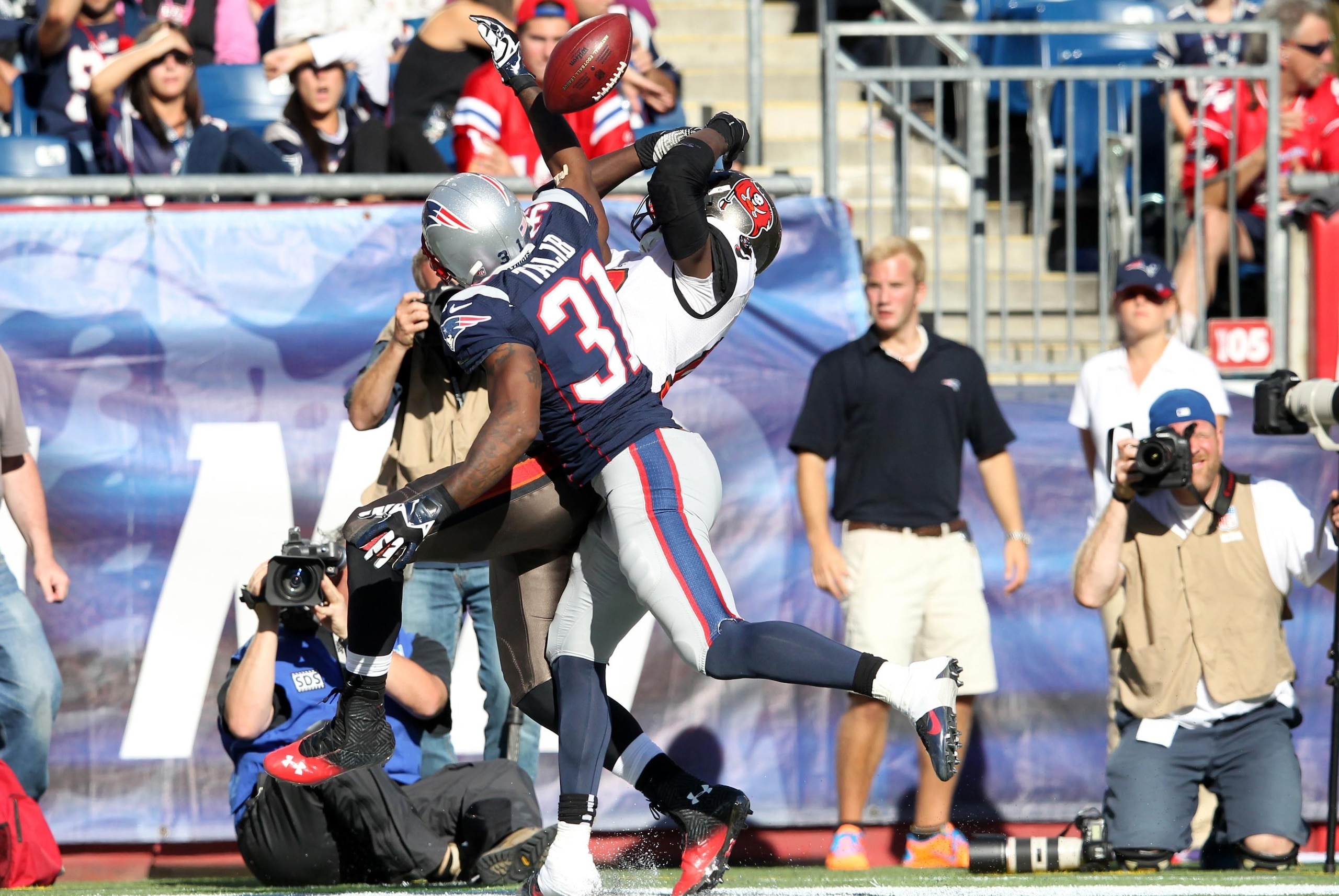Sep 22, 2013; Foxborough, MA, USA; Tampa Bay Buccaneers wide receiver Mike Williams (19) can't catch a ball while defended by New England Patriots corner back Aqib Talib (31) during the fourth quarter of a game at Gillette Stadium. The Patriots defeated t
