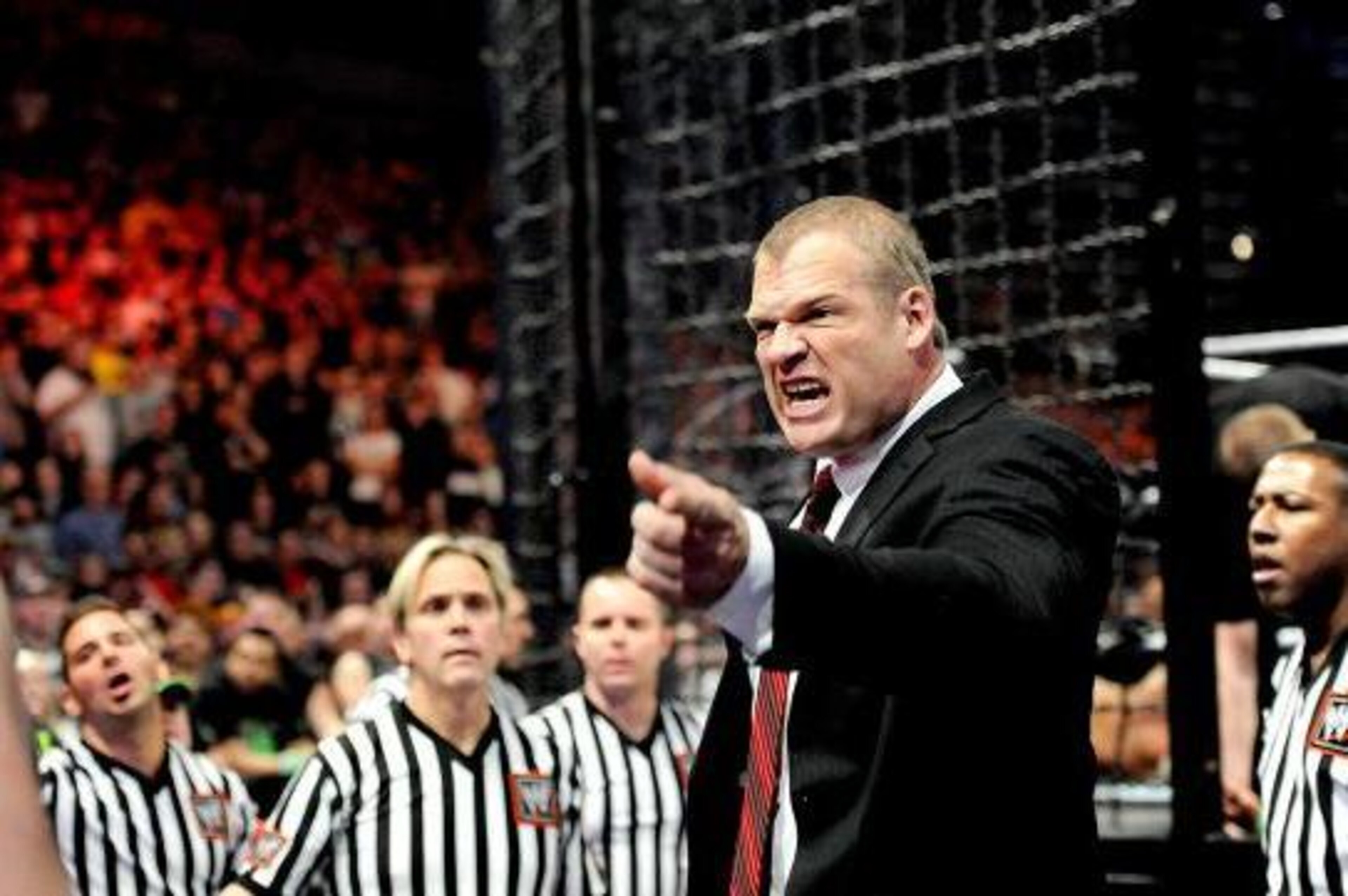 Kane scolds The Wyatt Family outside the Elimination Chamber.