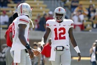 Sep 14, 2013; Berkeley, CA, USA; Ohio State Buckeyes quarterback Cardale Jones (12) stands on the field before the start of the game against the California Golden Bears at Memorial Stadium. Mandatory Credit: Cary Edmondson-USA TODAY Sports