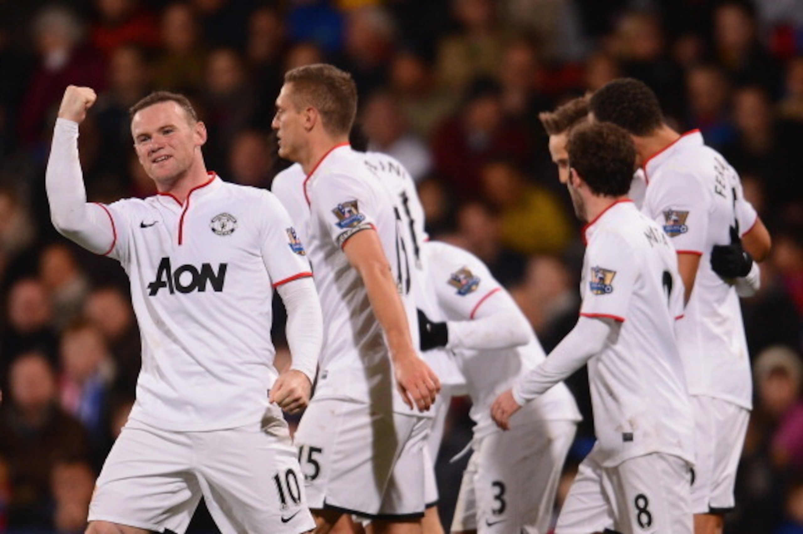 LONDON, ENGLAND - FEBRUARY 22:  Wayne Rooney of Manchester United celebrates with team mates after scoring during the Barclays Premier League match between Crystal Palace and Manchester United at Selhurst Park on February 22, 2014 in London, England.  (Ph