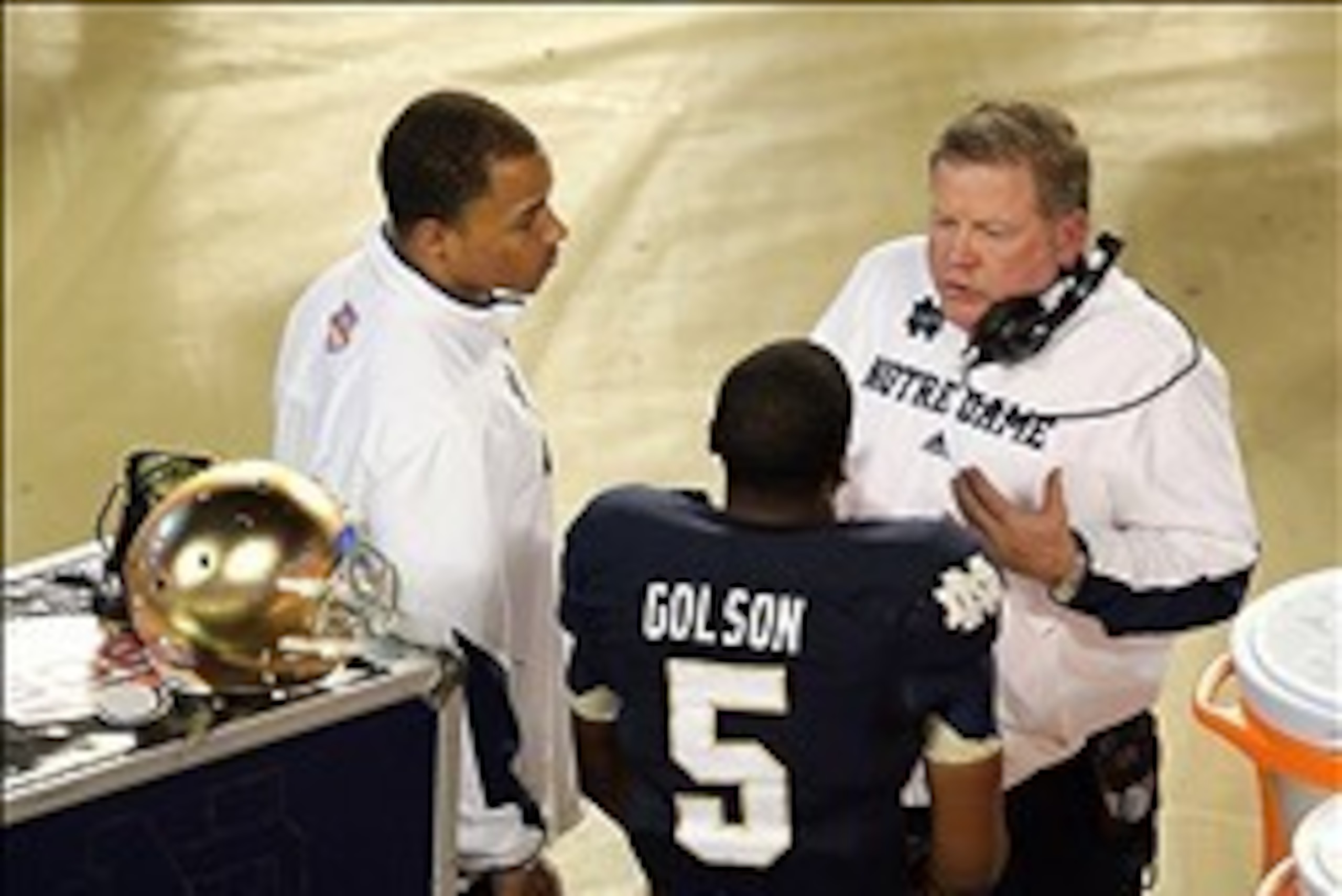 Jan 7, 2013; Miami, FL, USA; Notre Dame Fighting Irish head coach Brian Kelly talks with quarterback Everett Golson (5) during the second half of the 2013 BCS Championship game against the Alabama Crimson Tide at Sun Life Stadium.  Mandatory Credit: Rober