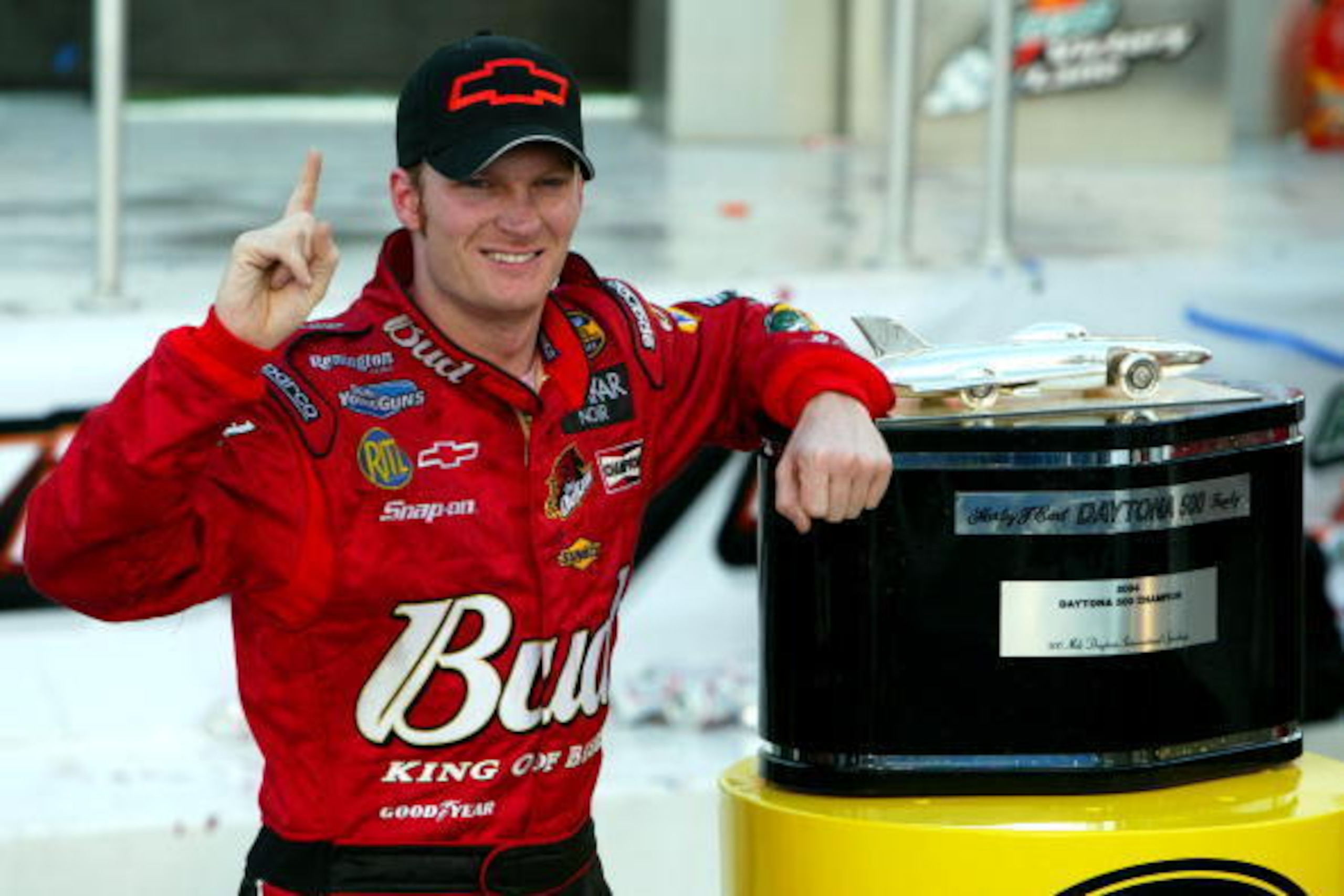 DAYTONA BEACH, FL - FEBRUARY 15: Dale Earnhardt Jr. driver of the #8 DEI Budweiser Chevrolet poses with the Harvey J. Earl Daytona 500 Trophy in victory circle after winning the NASCAR Nextel Cup Daytona 500 on February 15, 2004 at the Daytona Internation