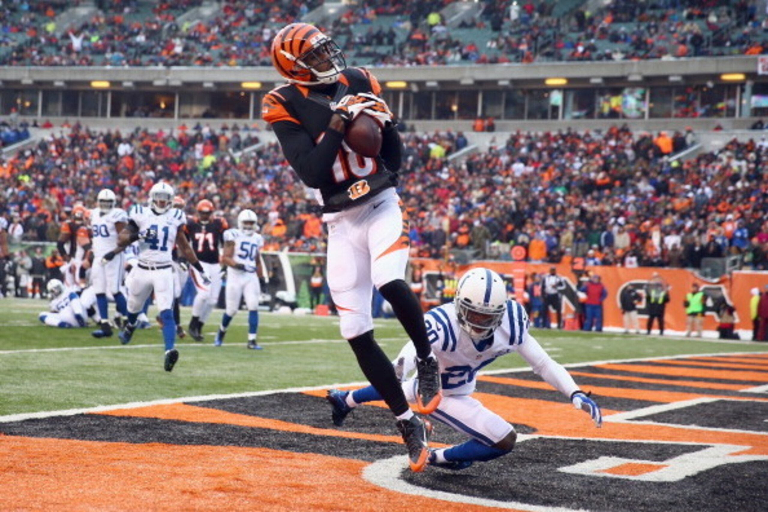 CINCINNATI, OH - DECEMBER 08:  A.J. Green#18  of the Cincinnati Bengals catches a touchdown pass during the NFL game against the Indianapolis Colts  at Paul Brown Stadium on December 8, 2013 in Cincinnati, Ohio.  (Photo by Andy Lyons/Getty Images)
