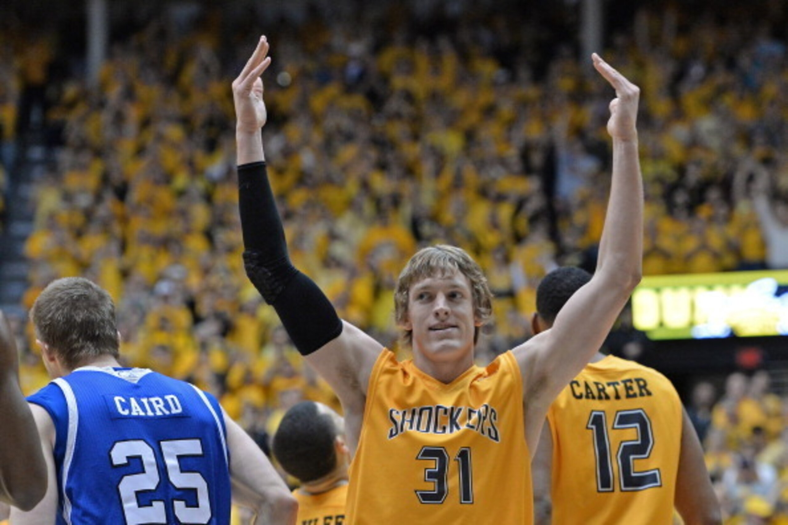 WICHITA, KS - FEBRUARY 22:  Guard Ron Baker #31 of the Wichita State Shockers reacts after a Shockers score against the Drake Bulldogs during the second half on February 22, 2014 at Charles Koch Arena in Wichita, Kansas.  Wichita State won 83-54.  (Photo 