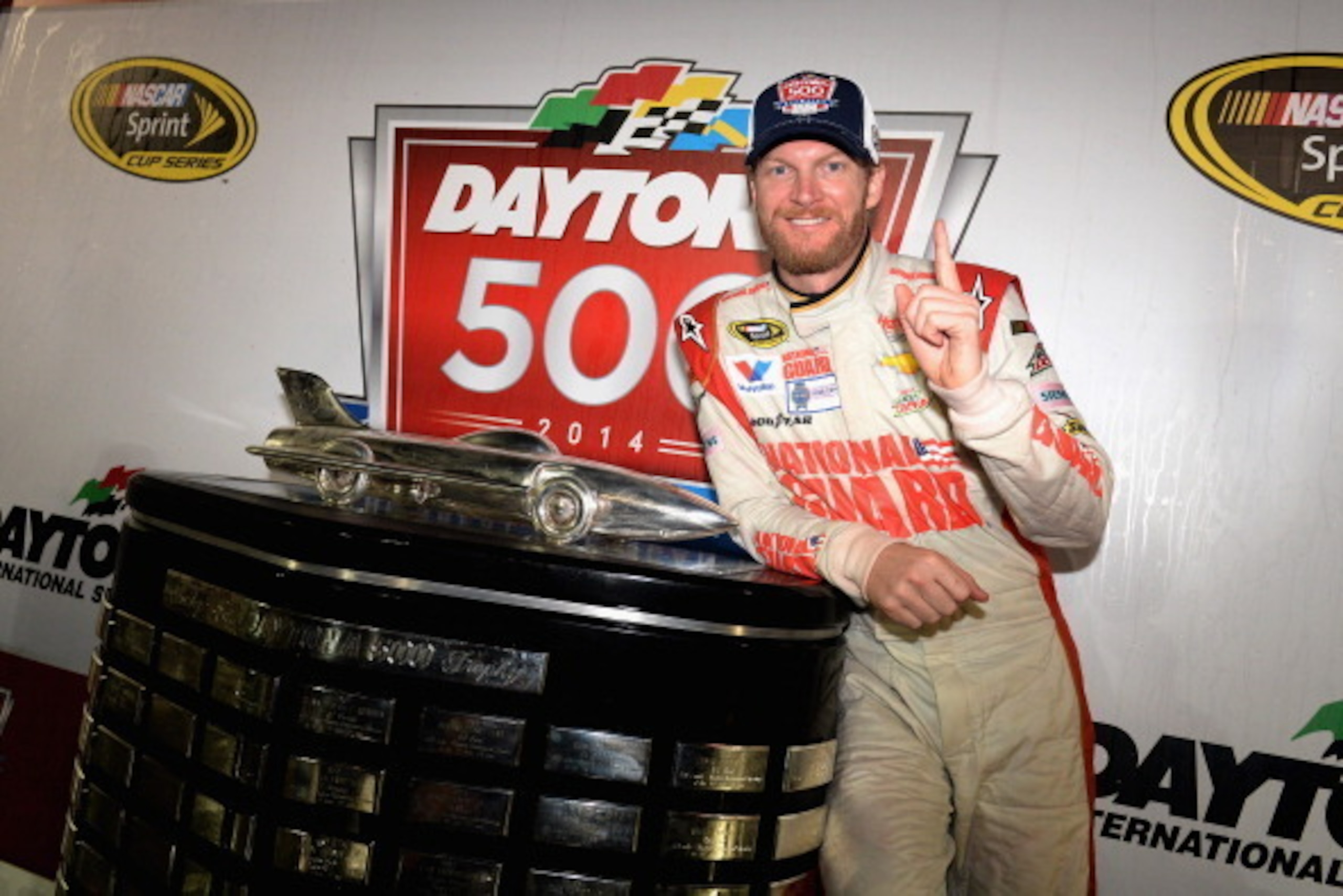 DAYTONA BEACH, FL - FEBRUARY 23:  Dale Earnhardt Jr., driver of the #88 National Guard Chevrolet, celebrates in Victory Lane with the the Harley J. Earl trophy after winning the NASCAR Sprint Cup Series Daytona 500 at Daytona International Speedway on Feb