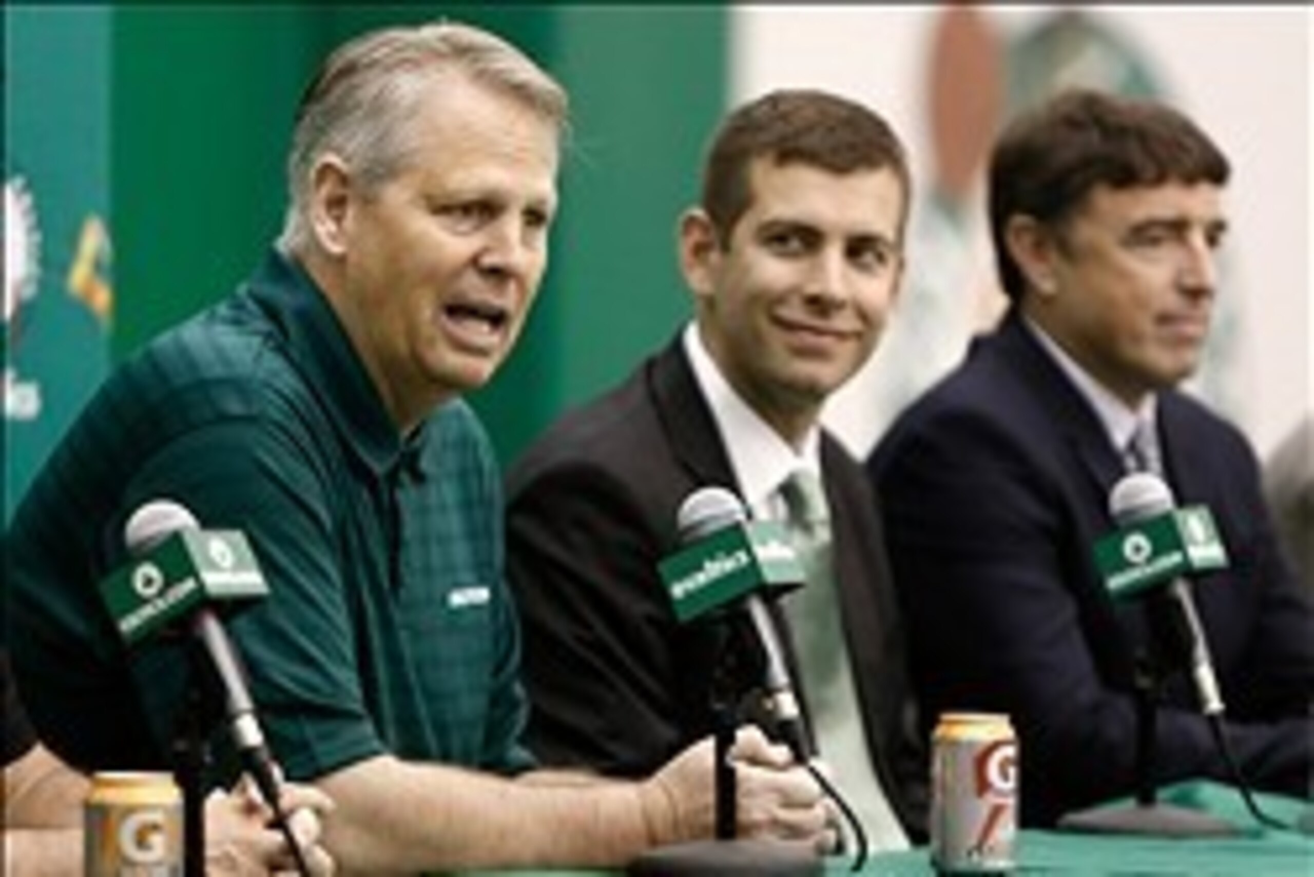 Jul 5, 2013; Waltham, MA, USA; General Manager Danny Ainge talks about hiring new Boston Celtics head coach Brad Stevens, center, as owner Wyc Grousbeck, right, listens in during a news conference announcing Stevens new position. Mandatory Credit: Winslow