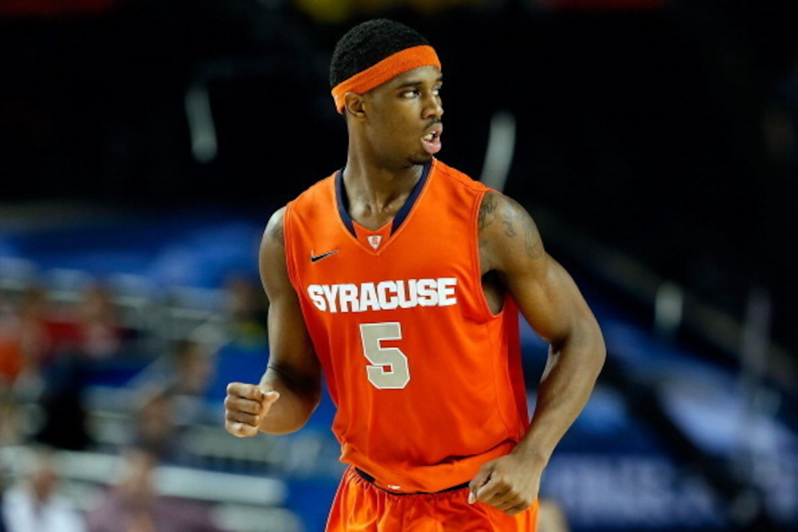 ATLANTA, GA - APRIL 06:  C.J. Fair #5 of the Syracuse Orange reacts in the second half against the Michigan Wolverines during the 2013 NCAA Men's Final Four Semifinal at the Georgia Dome on April 6, 2013 in Atlanta, Georgia.  (Photo by Kevin C. Cox/Getty 
