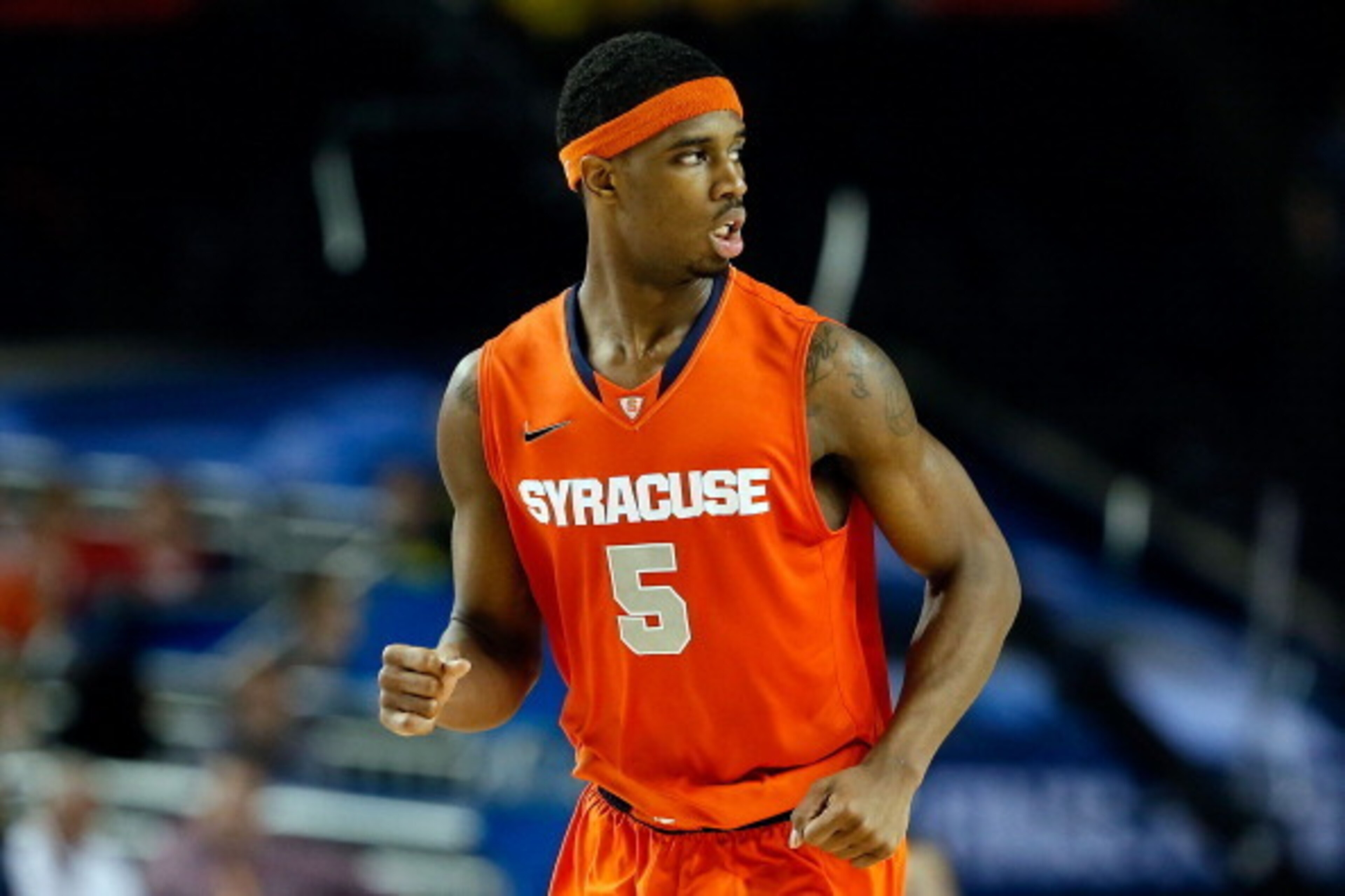 ATLANTA, GA - APRIL 06: C.J. Fair #5 of the Syracuse Orange reacts in the second half against the Michigan Wolverines during the 2013 NCAA Men's Final Four Semifinal at the Georgia Dome on April 6, 2013 in Atlanta, Georgia. (Photo by Kevin C. Cox/Getty ATLANTA, GA - APRIL 06: C.J. Fair #5 of the Syracuse Orange reacts in the second half against the Michigan Wolverines during the 2013 NCAA Men's Final Four Semifinal at the Georgia Dome on April 6, 2013 in Atlanta, Georgia. (Photo by Kevin C. Cox/Getty
