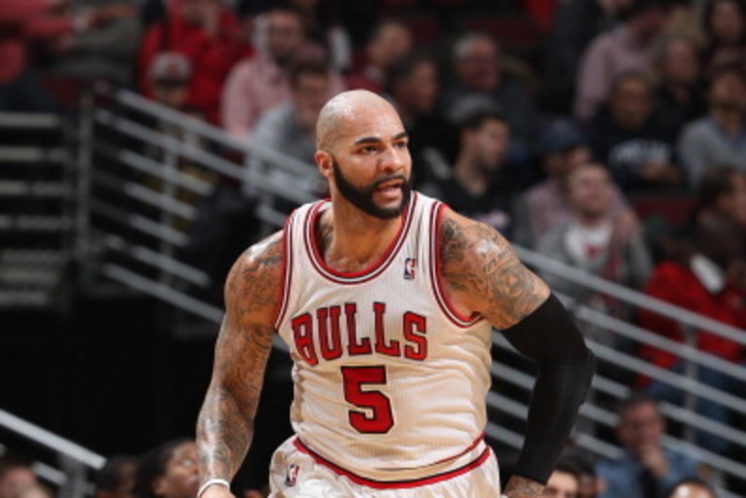 CHICAGO, IL - JANUARY 24: Carlos Boozer #5 of the Chicago Bulls runs down courts during the game against the Los Angeles Clippers on January 24, 2014 at the United Center in Chicago, Illinois. NOTE TO USER: User expressly acknowledges and agrees that, by