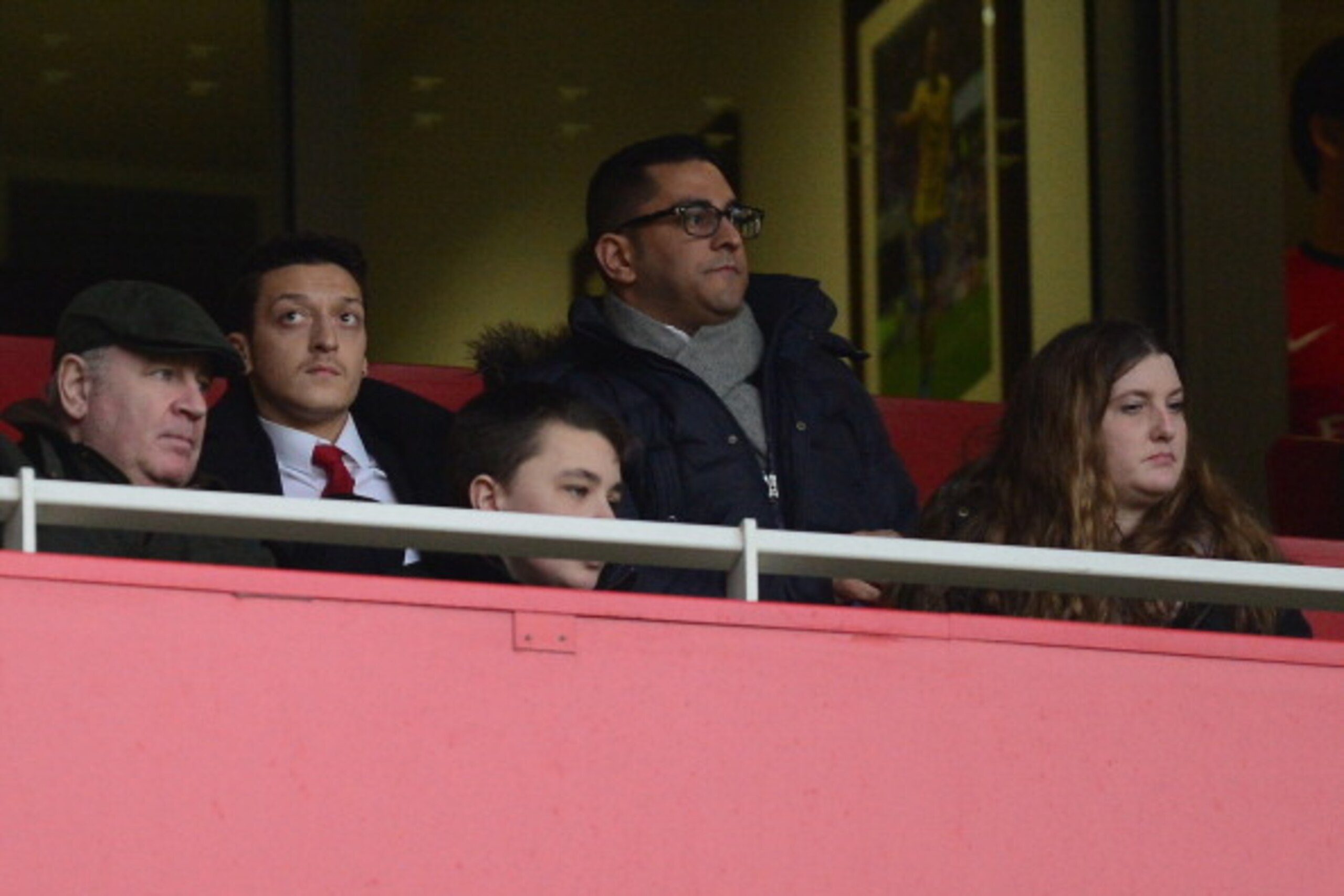 LONDON, ENGLAND - FEBRUARY 22:  Mesut Ozil of Arsenal watches from the stands during the Barclays Premier League match between Arsenal and Sunderland at Emirates Stadium on February 22, 2014 in London, England.  (Photo by Jamie McDonald/Getty Images)
