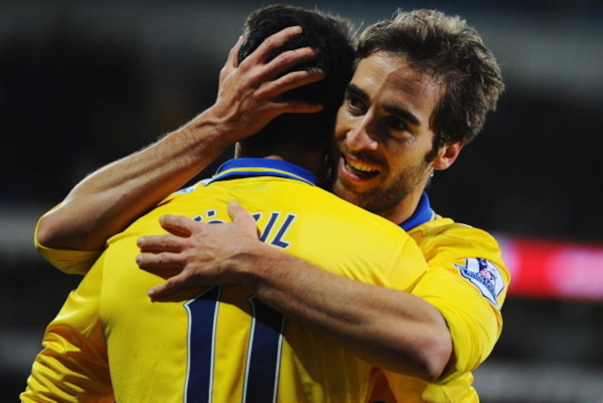 CARDIFF, WALES - NOVEMBER 30:  Mathieu Flamini of Arsenal (R) celebrates with Mesut Oezil as he scores their second goal during the Barclays Premier League match between Cardiff City and Arsenal at Cardiff City Stadium on November 30, 2013 in Cardiff, Wal