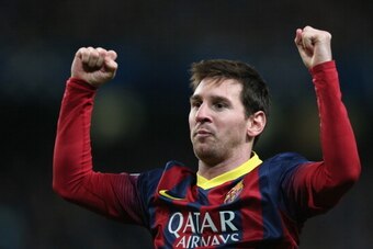 MANCHESTER, ENGLAND - FEBRUARY 18:  Lionel Messi of Barcelona celebrates scoring the opening goal from a penalty kick during the UEFA Champions League Round of 16 first leg match between Manchester City and Barcelona at the Etihad Stadium on February 18, 