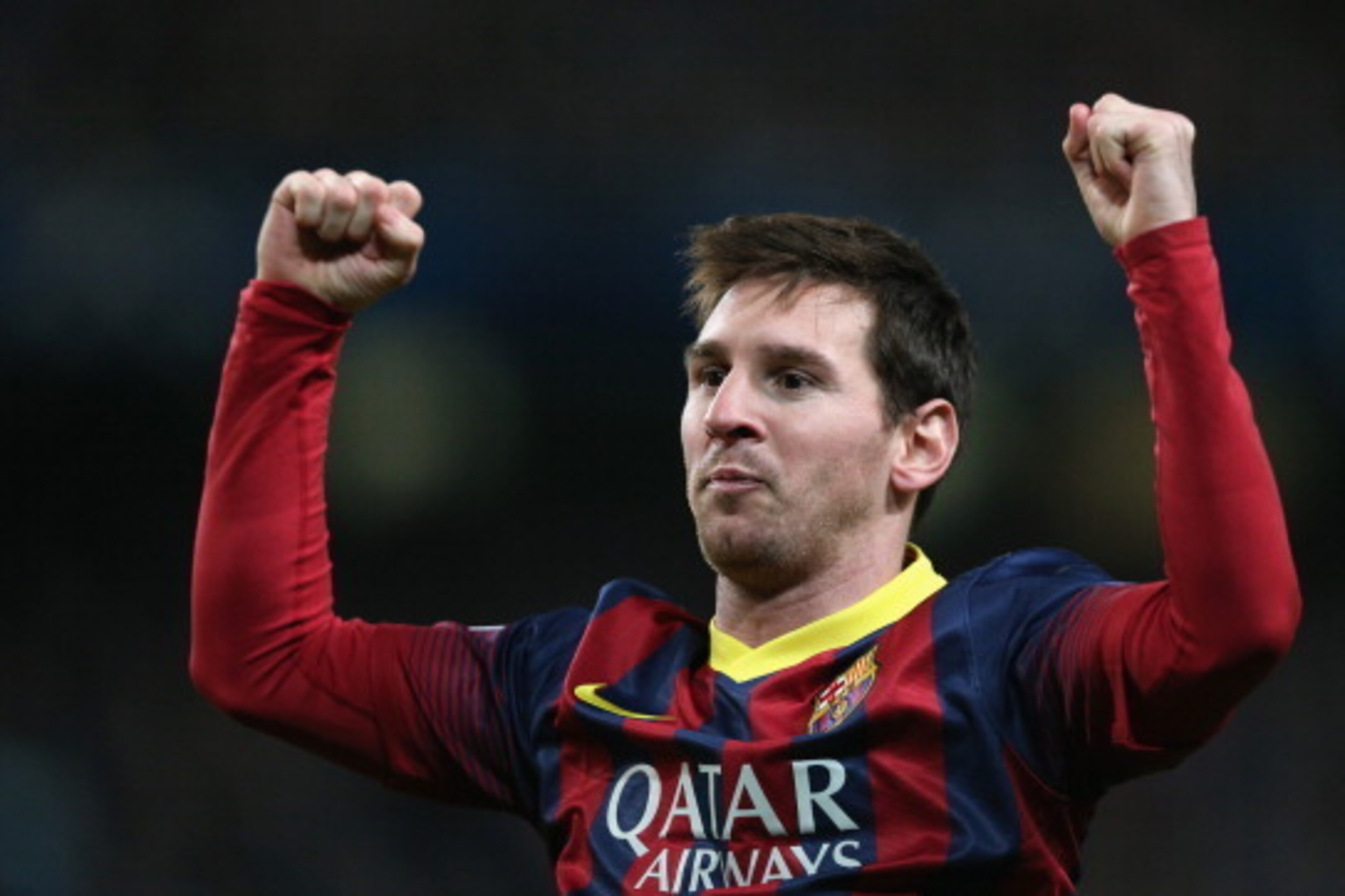 MANCHESTER, ENGLAND - FEBRUARY 18:  Lionel Messi of Barcelona celebrates scoring the opening goal from a penalty kick during the UEFA Champions League Round of 16 first leg match between Manchester City and Barcelona at the Etihad Stadium on February 18, 