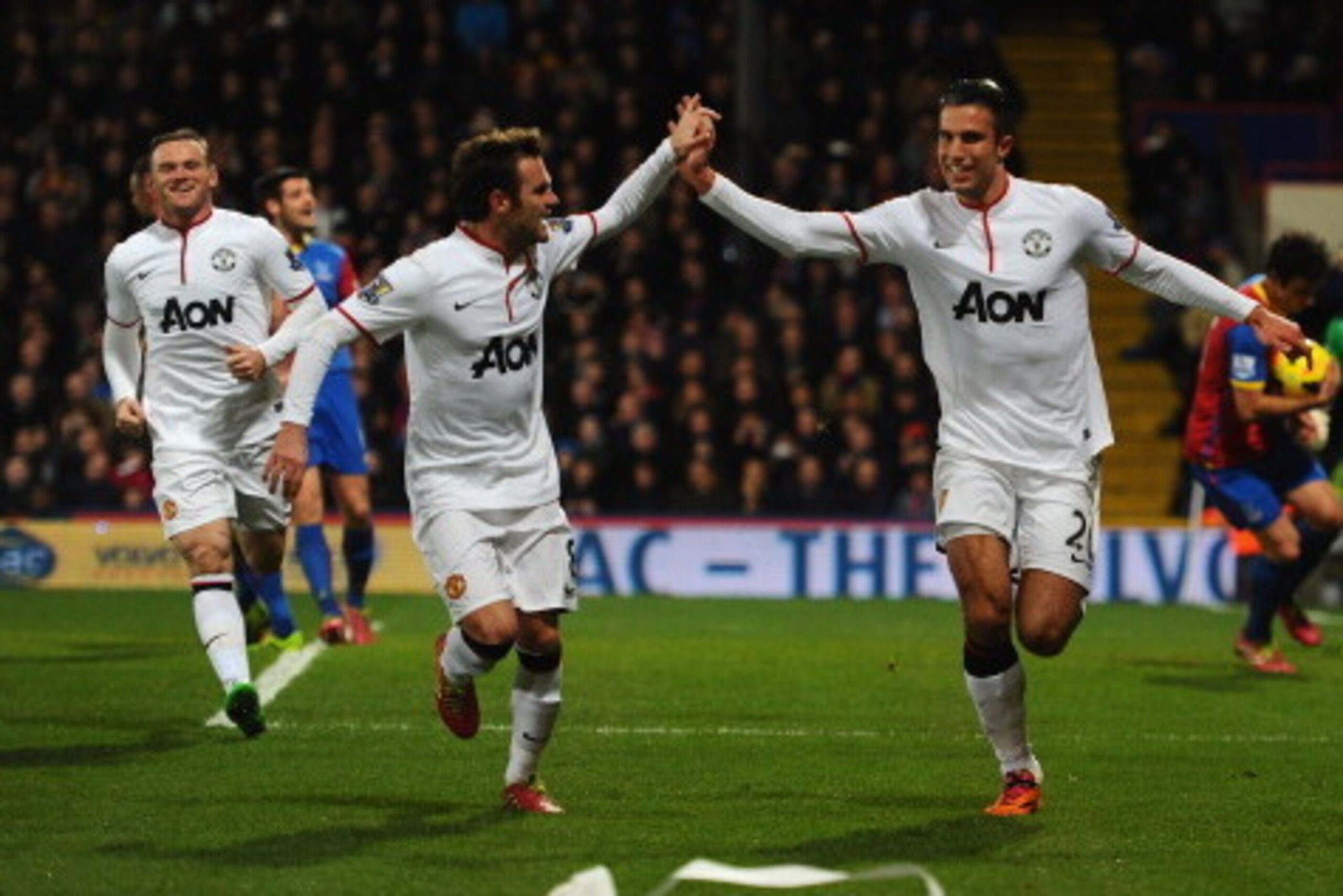 LONDON, ENGLAND - FEBRUARY 22:  Robin Van Persie of Man United celebrates with Juan Mata after scoring from the spot during the Barclays Premier League match between Crystal Palace and Manchester United at Selhurst Park on February 22, 2014 in London, Eng