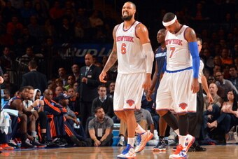 NEW YORK, NY - NOVEMBER 5: (L-R) Tyson Chandler #6 and Carmelo Anthony #7 of the New York Knicks walk on the court against the Charlotte Bobcats during the game on November 5, 2013 at Madison Square Garden in New York City, New York. NOTE TO USER: User ex