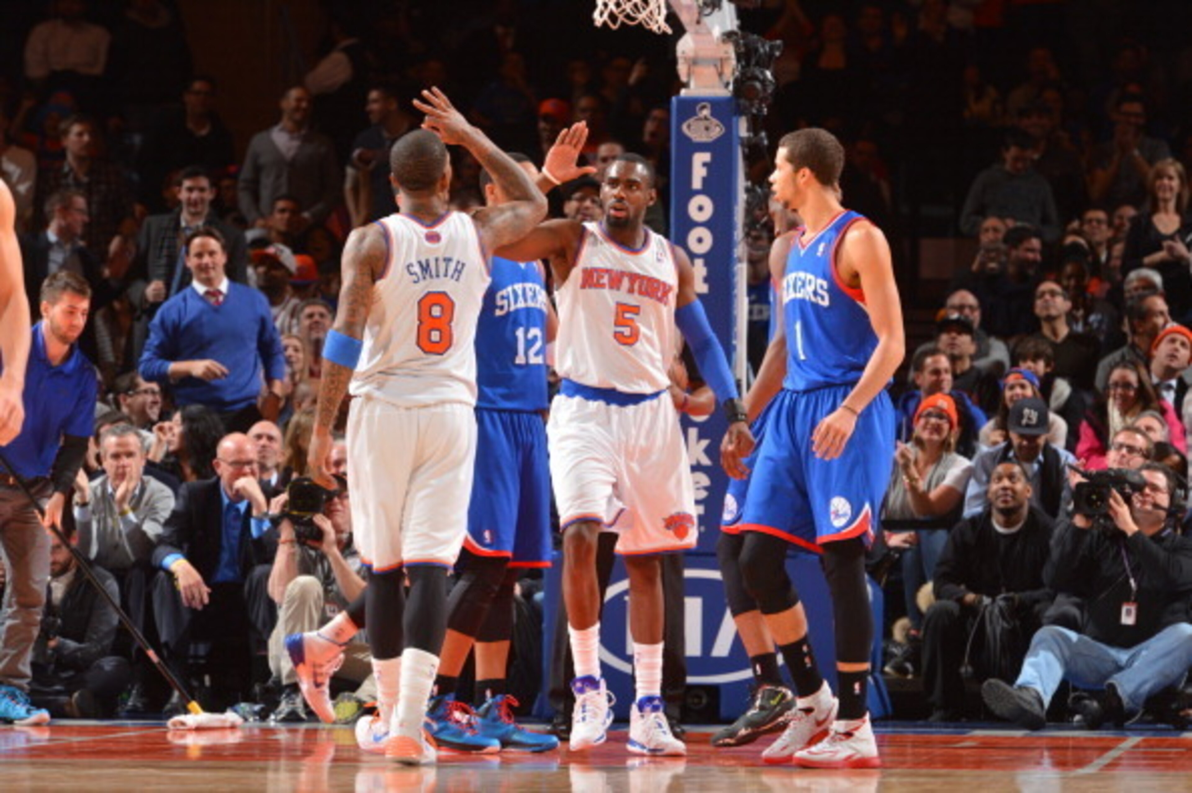 NEW YORK, NY - JANUARY 22: J.R. Smith #8 high fives Tim Hardaway Jr. #5 of the New York Knicks against the Philadelphia 76ers during the game on January 22, 2014 at Madison Square Garden in New York City, New York.   NOTE TO USER: User expressly acknowled