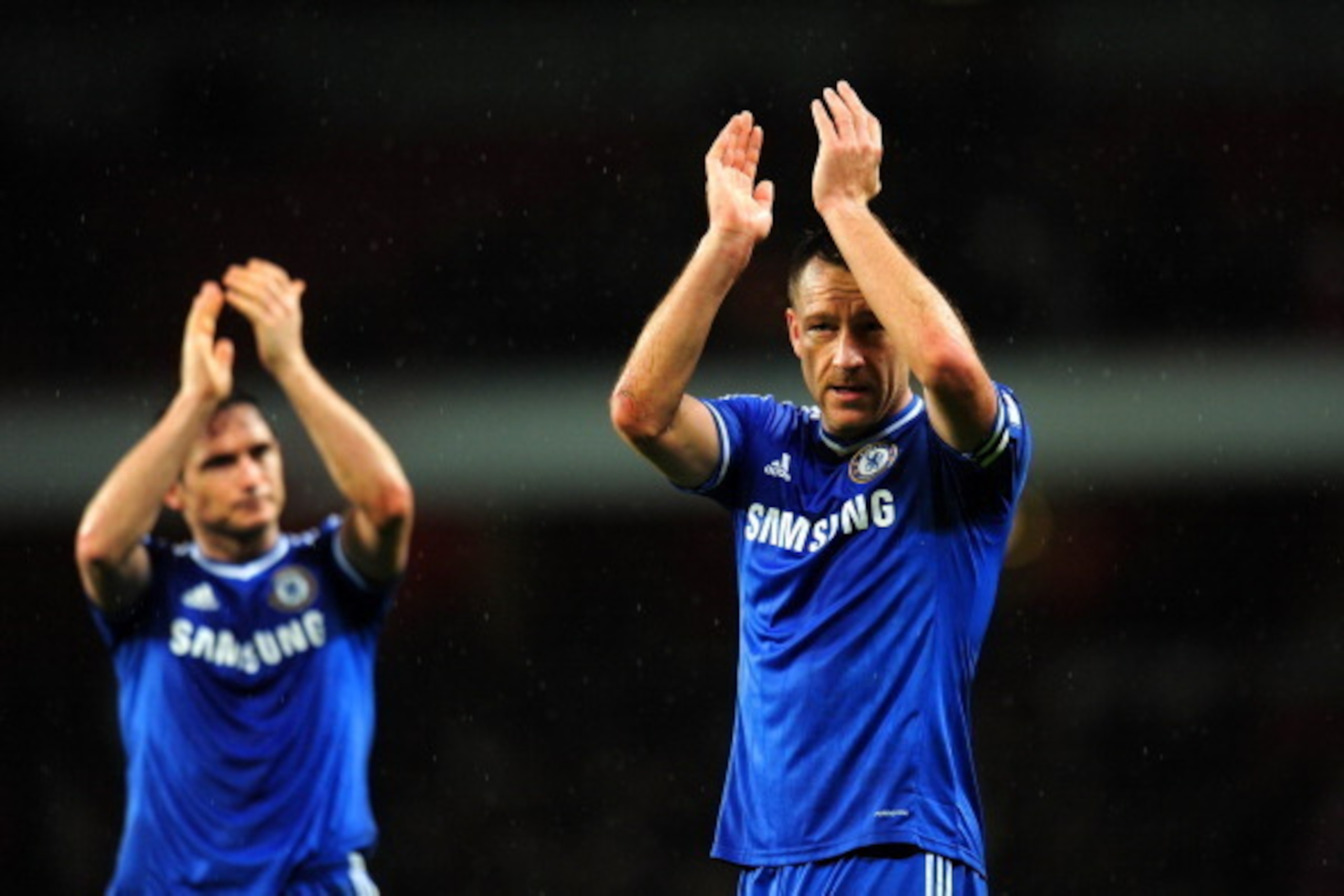 LONDON, ENGLAND - DECEMBER 23:  Frank Lampard and John Terry of Chelsea applaud the fans at the final whistle during the Barclays Premier League match between Arsenal and Chelsea at Emirates Stadium on December 23, 2013 in London, England.  (Photo by Shau