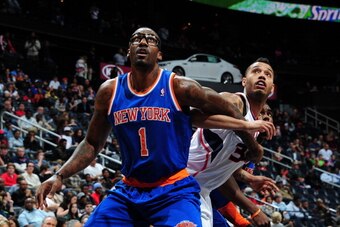 ATLANTA, GA - FEBRUARY 22:  Amar'e Stoudemire #1 of the New York Knicks boxes out during a game against the Atlanta Hawks on February 22, 2014 at Philips Arena in Atlanta, Georgia.  NOTE TO USER: User expressly acknowledges and agrees that, by downloading