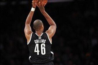 February 23, 2014; Los Angeles, CA, USA; Brooklyn Nets center Jason Collins (46) attempts a shot against the Los Angeles Lakers during the second half at Staples Center. Mandatory Credit: Gary A. Vasquez-USA TODAY Sports