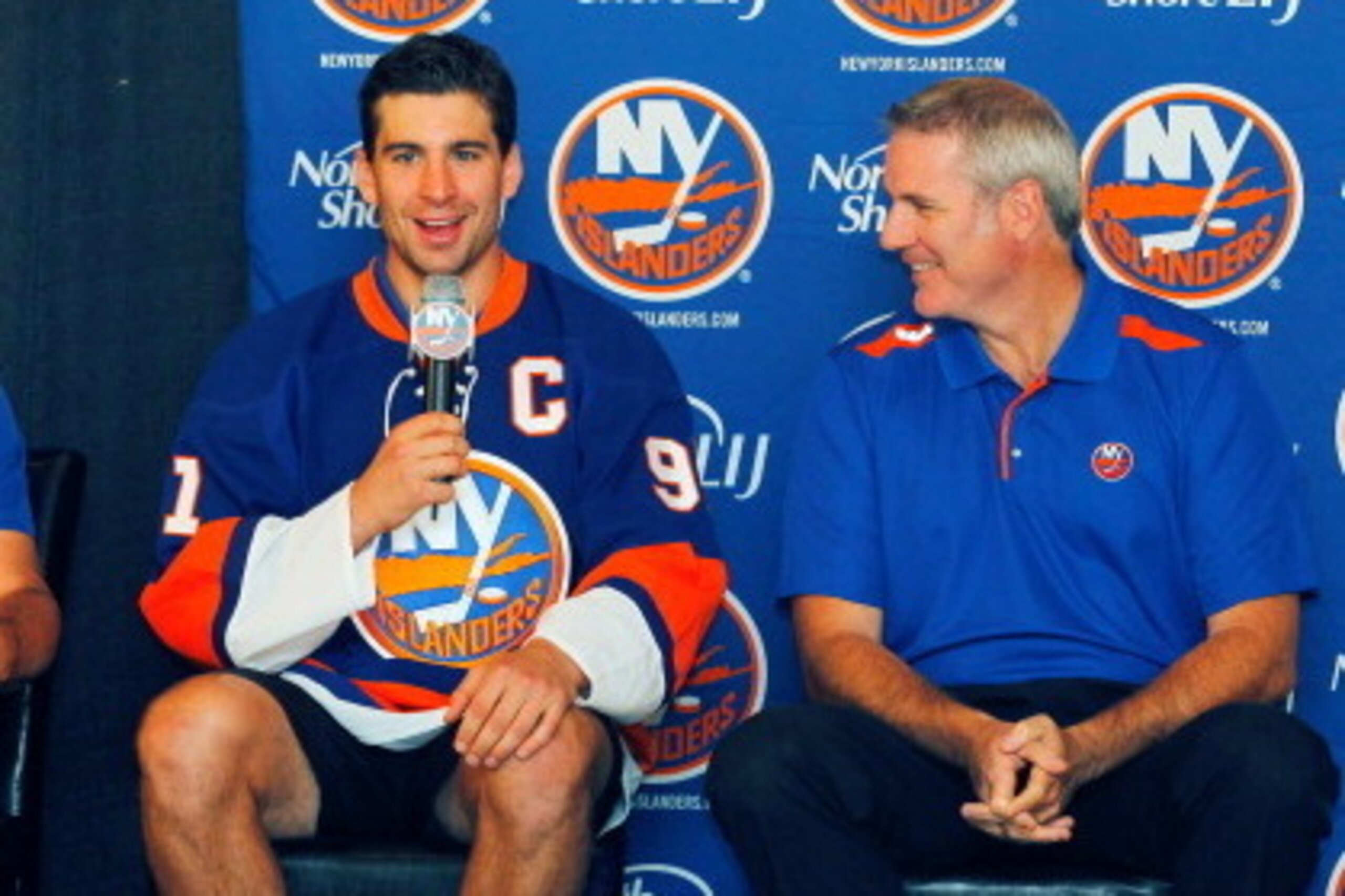 BETHPAGE, NY - SEPTEMBER 09:  John Tavares (C) addresses the media as Head Coach Jack Capuano (L) and General Manager Garth Snow of the New York Islanders look on during a press conference naming John Tavares the New York Islanders team captain at Carlyle