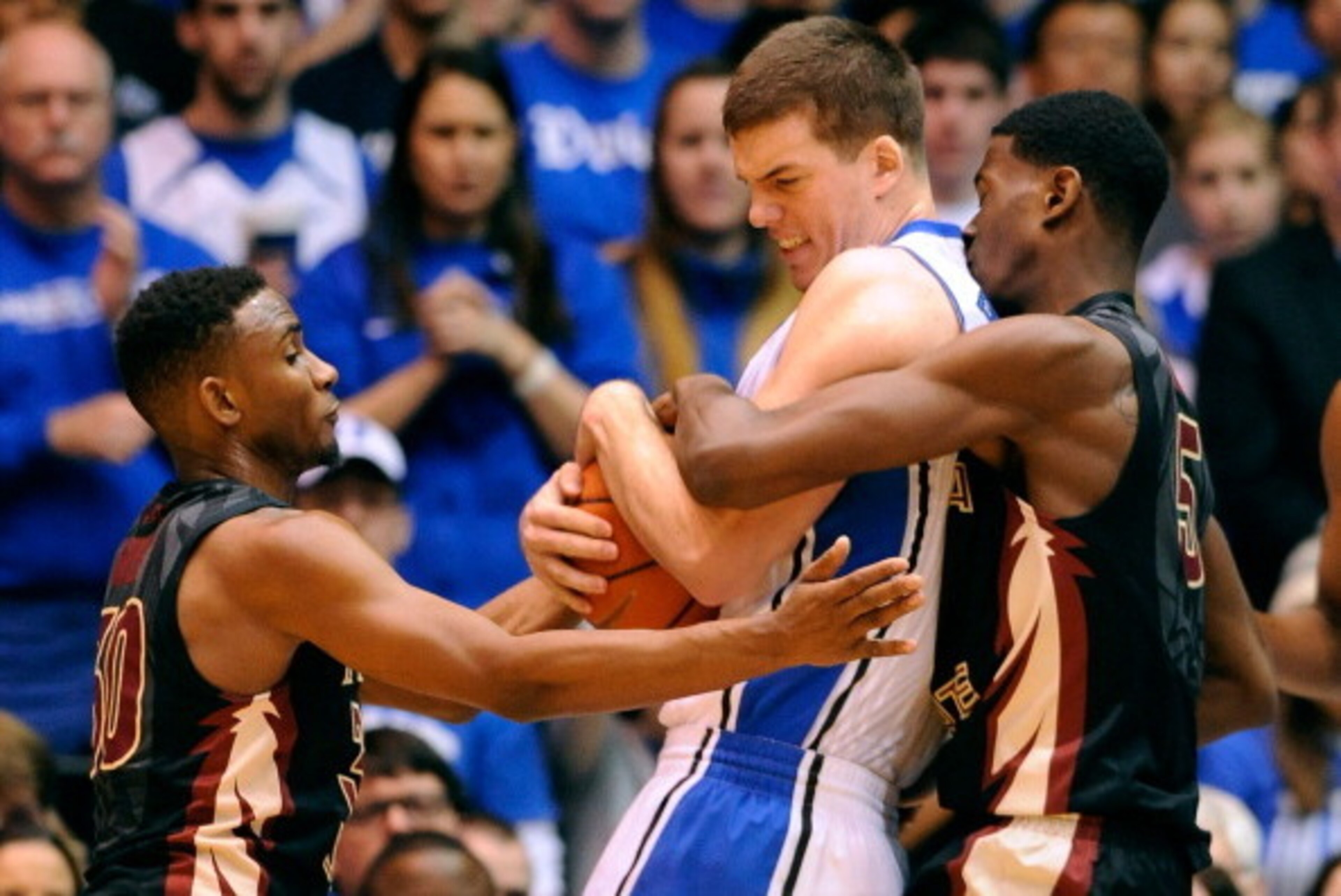 DURHAM, NC - JANUARY 25:  Jarquez Smith #5 of the Florida State Seminoles fouls Marshall Plumlee #40 of the Duke Blue Devils during their game at Cameron Indoor Stadium on January 25, 2014 in Durham, North Carolina. Duke won 78-56.  (Photo by Grant Halver