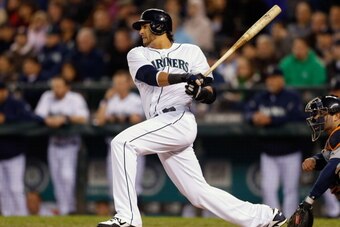 SEATTLE, WA - APRIL 16:  Michael Morse of the Seattle Mariners hits an RBI single in the fourth inning against the Detroit Tigers at Safeco Field on April 16, 2013 in Seattle, Washington. All uniformed team members are wearing jersey number 42 in honor of