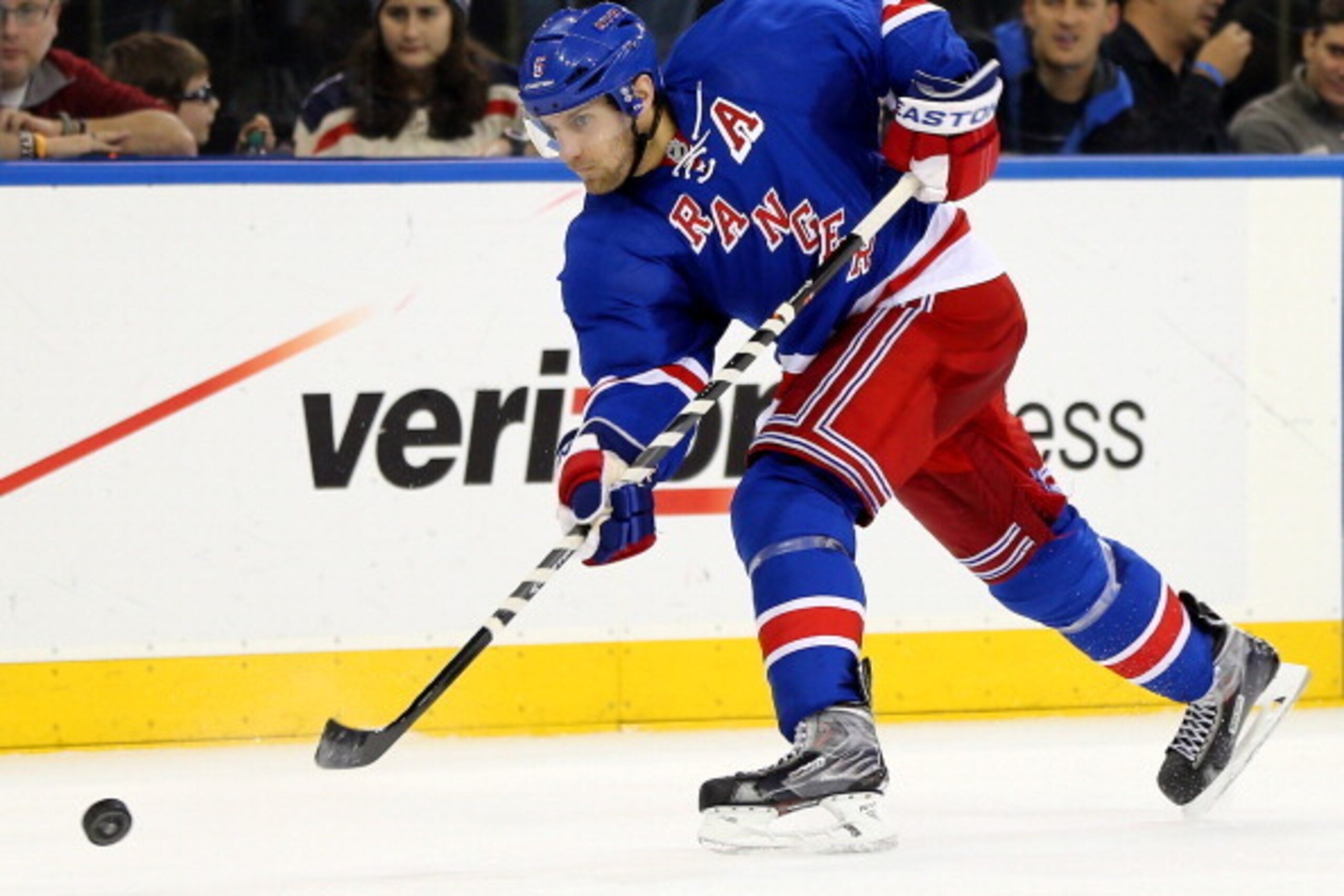 NEW YORK, NY - DECEMBER 12:  Dan Girardi #5 of the New York Rangers takes a shot in the second period against the Columbus Blue Jackets at Madison Square Garden on December 12, 2013 in New York City.  (Photo by Elsa/Getty Images)