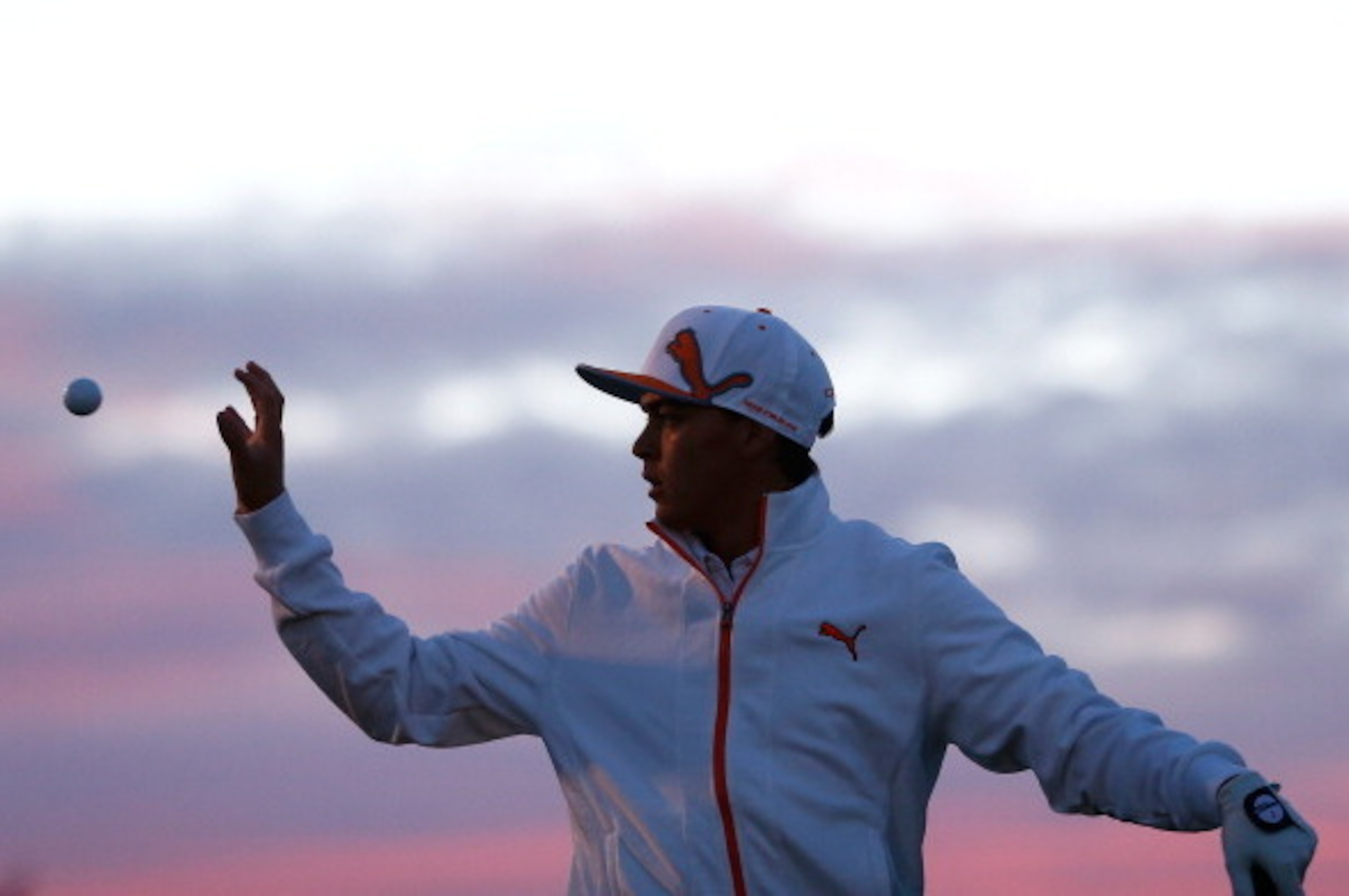 MARANA, AZ - FEBRUARY 23:  Rickie Fowler catches a ball during practice prior to his semifinal round match against Jason Day of Australia (not in photo) during the World Golf Championships - Accenture Match Play Championship at The Golf Club at Dove Mount