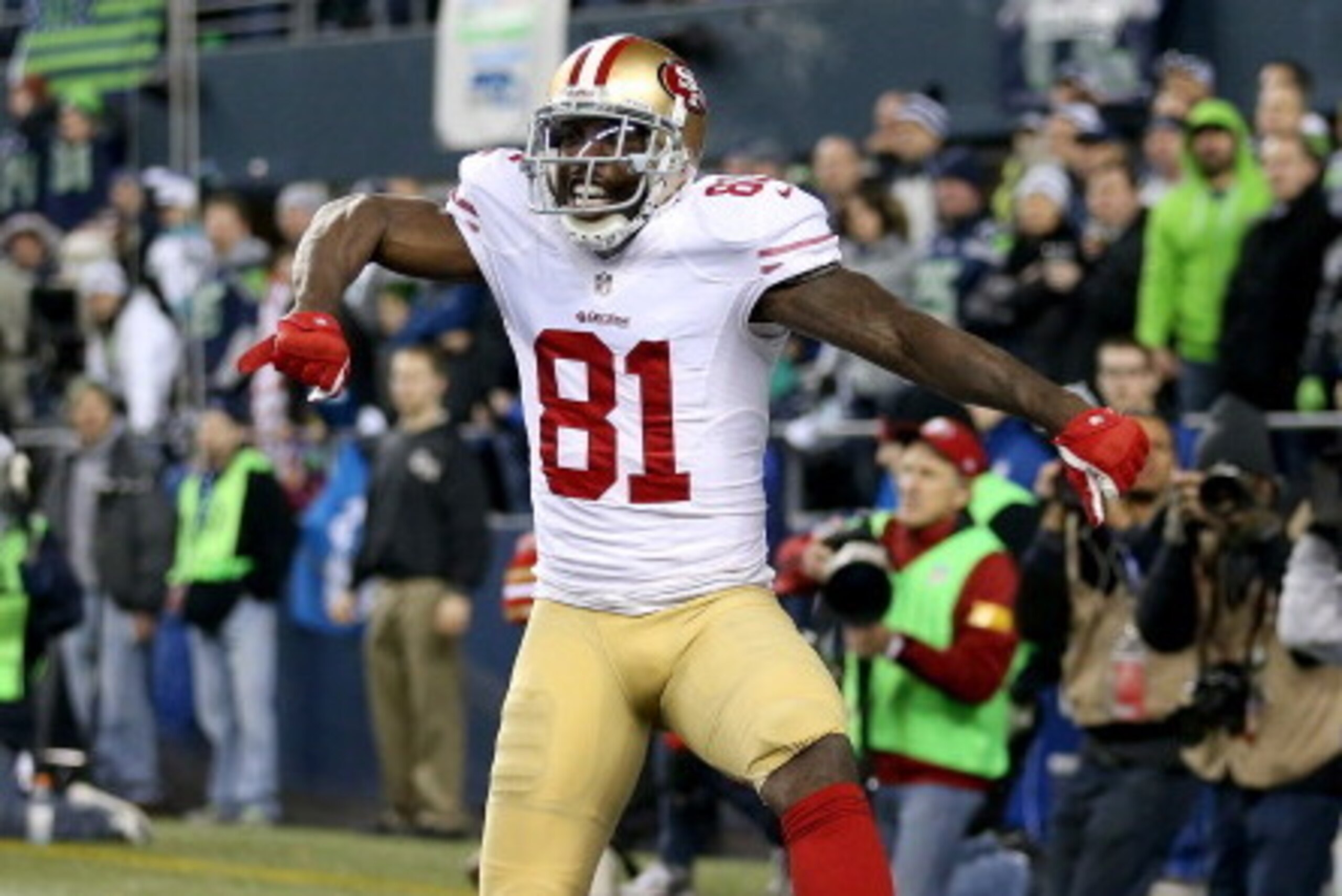 SEATTLE, WA - JANUARY 19:  Wide receiver Anquan Boldin #81 of the San Francisco 49ers celebrates after making a 26-yard touchdown catch against the Seattle Seahawks in the third quarter during the 2014 NFC Championship at CenturyLink Field on January 19, 