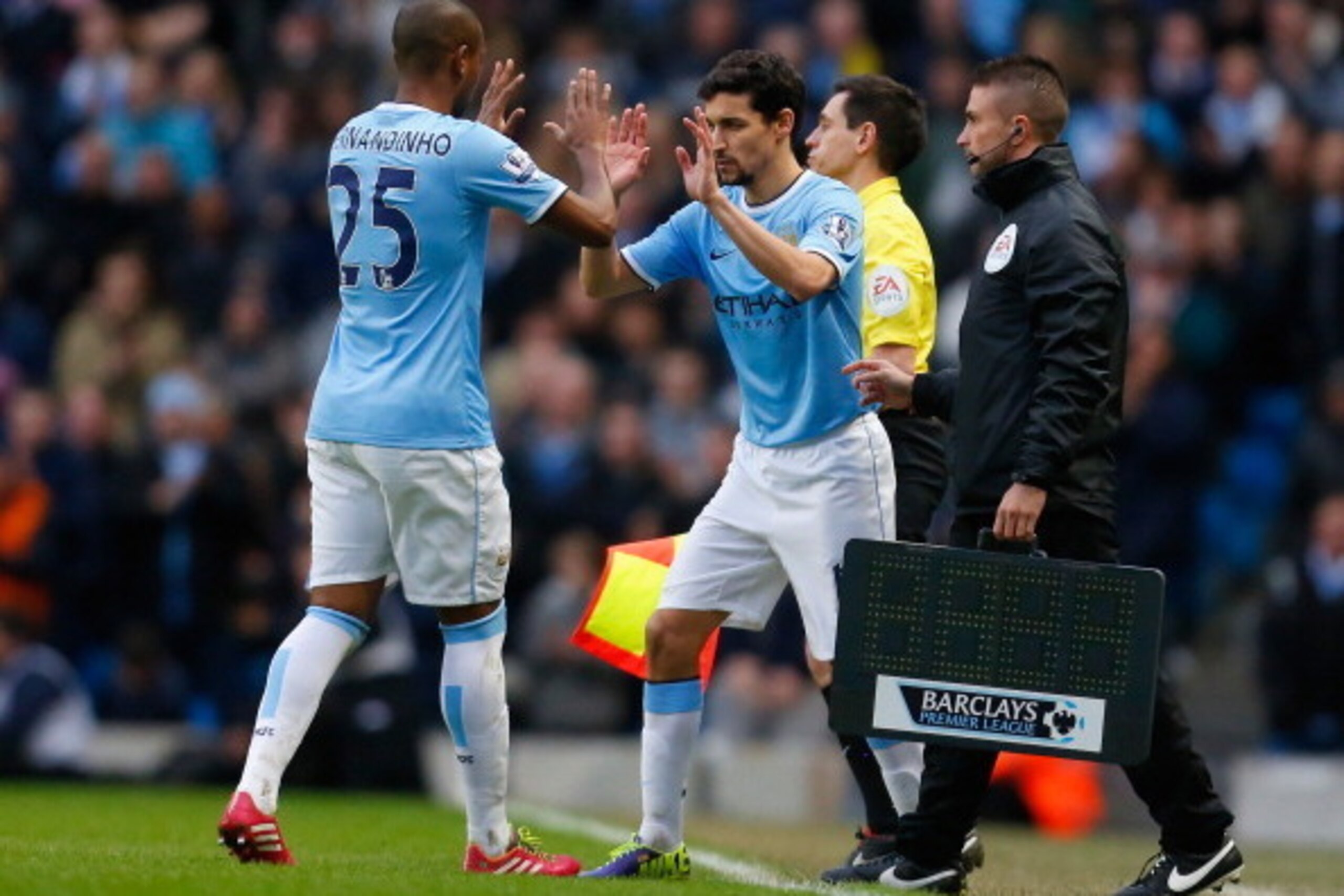 MANCHESTER, ENGLAND - FEBRUARY 22:  Jesus Navas of Manchester City replaces Fernandinho during the Barclays Premier League match between Manchester City and Stoke City at the Etihad Stadium on February 22, 2014 in Manchester, England.  (Photo by Paul Thom