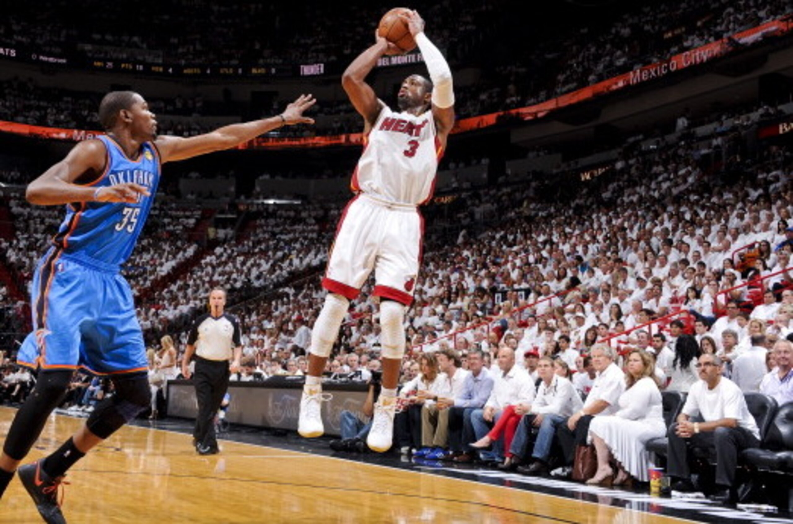 MIAMI, FL - JUNE 19: Dwyane Wade #3 of the Miami Heat shoots against Kevin Durant #35 of the Oklahoma City Thunder in Game Four of the 2012 NBA Finals at American Airlines Arena on June 19, 2012 in Miami, Florida. NOTE TO USER: User expressly acknowledges